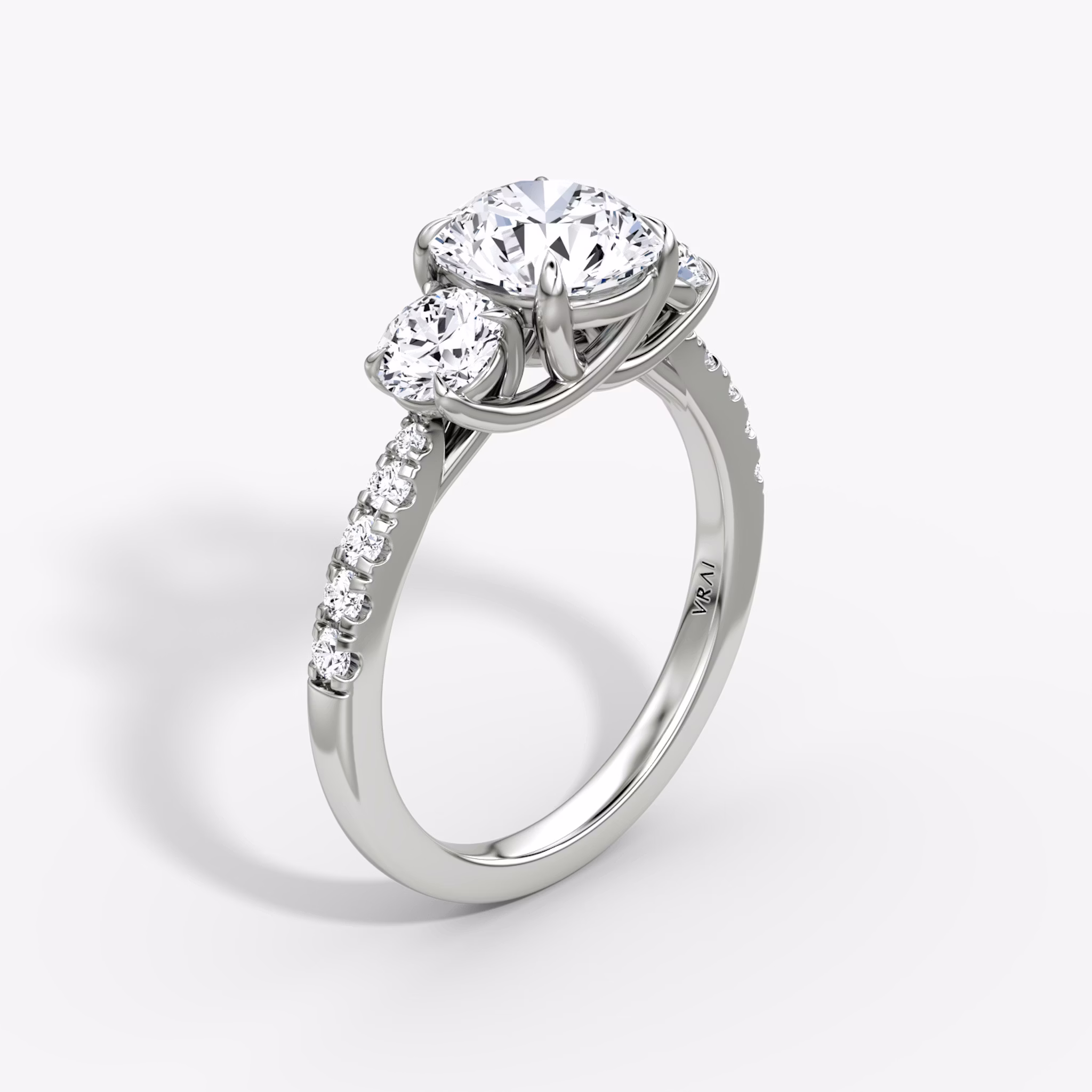 The Trellis Three Stone | Round Brilliant | Platinum | bandAccent: Pavé | caratWeight: other | diamondOrientation: vertical
