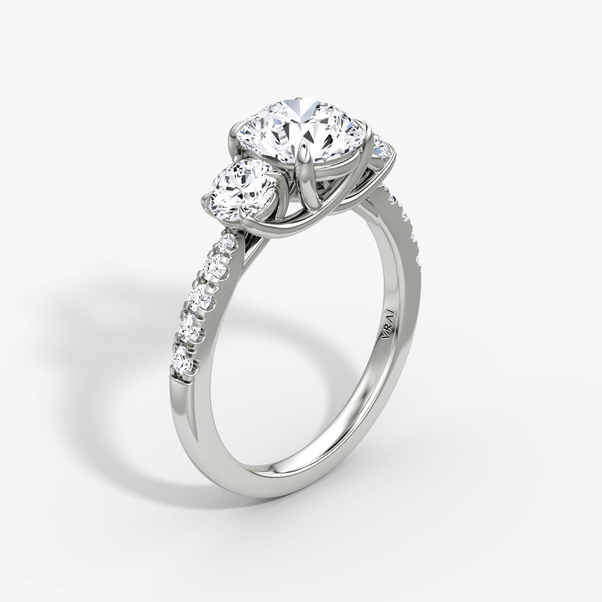 The Trellis Three Stone | Round Brilliant | Platinum | bandAccent: Pavé | caratWeight: other | diamondOrientation: vertical