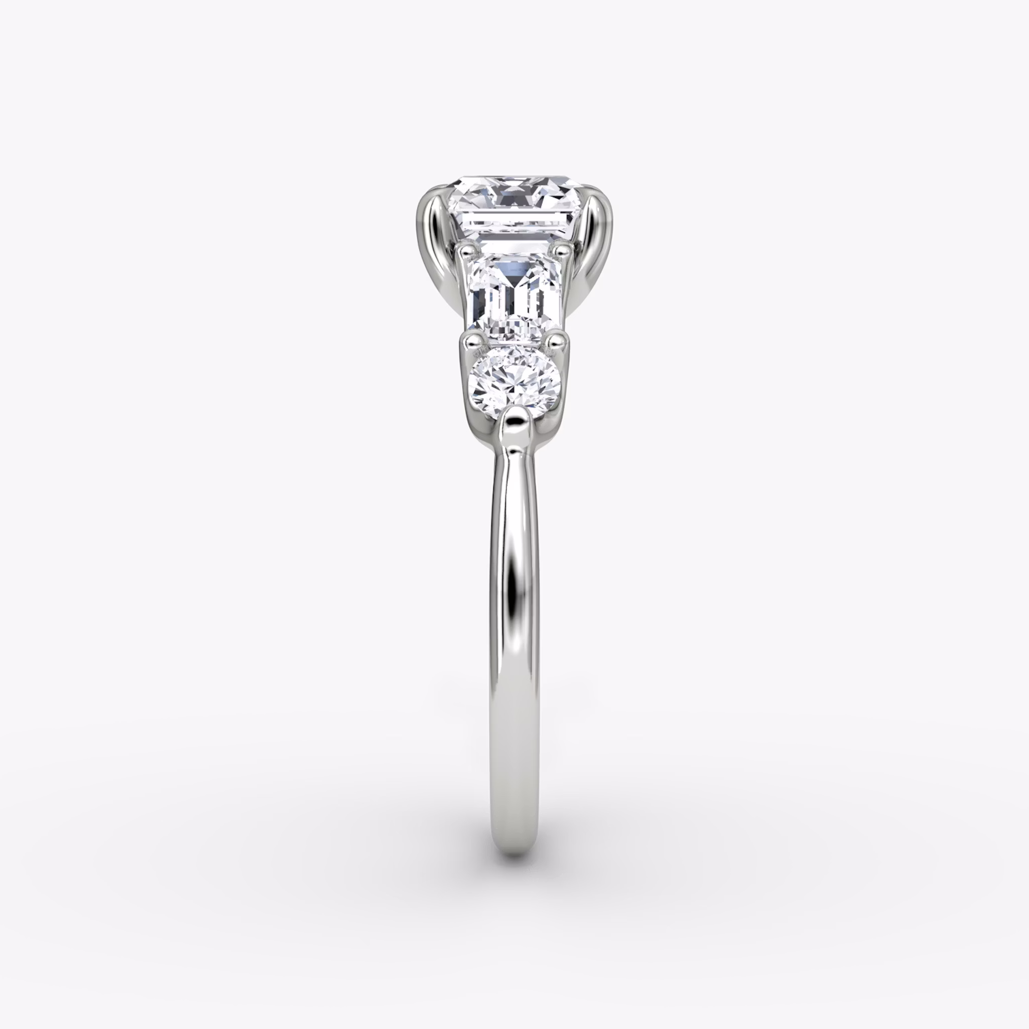 The Mixed Shape | Asscher | 18k | White Gold | bandAccent: Plain | sideStoneOrientation: horizontal | sideStoneShape: Emerald and Round Brilliant | diamondOrientation: vertical | caratWeight: other