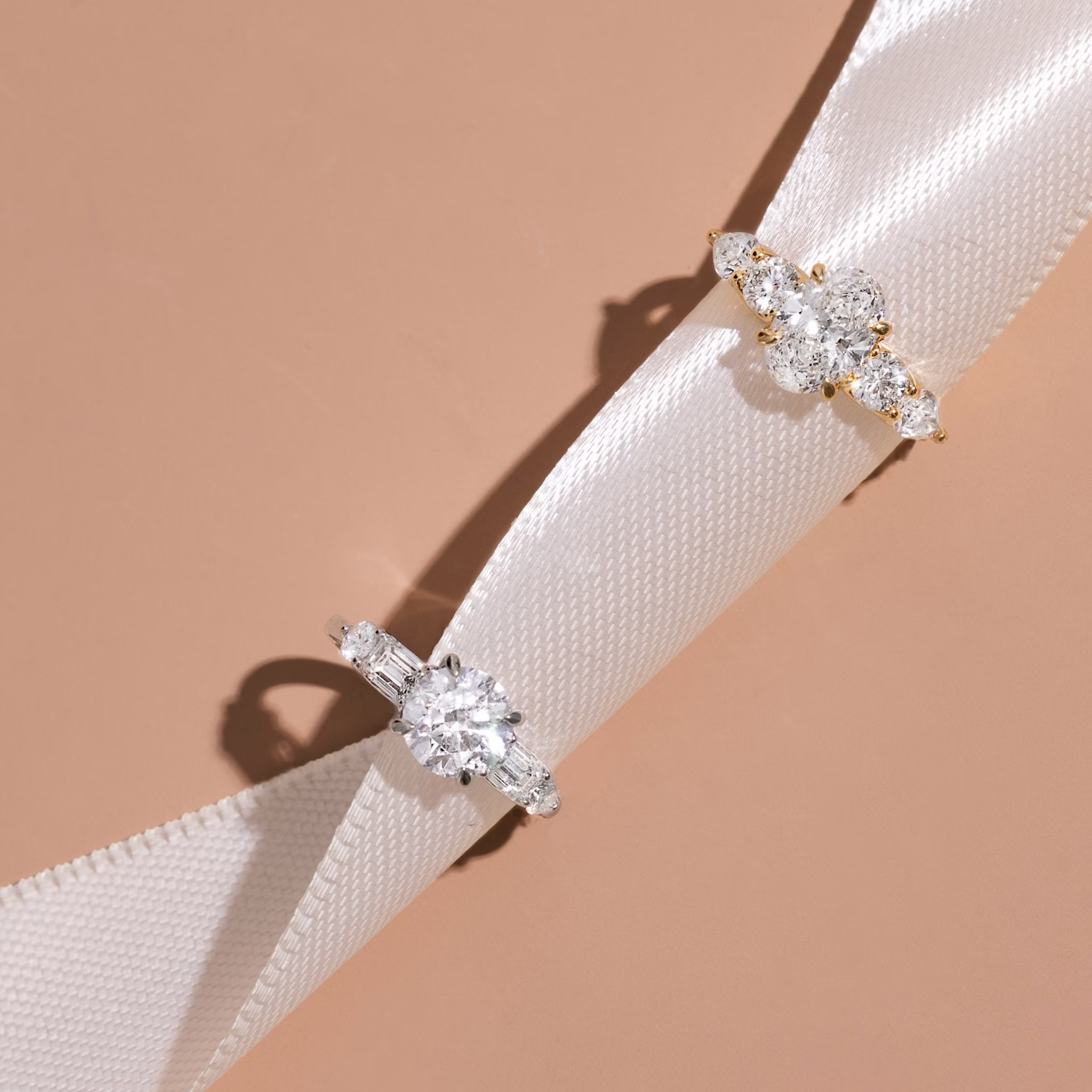 The Mixed Shape | Round Brilliant | Platinum | bandAccent: Plain | caratWeight: 1.0ct | sideStoneOrientation: horizontal | sideStoneShape: Round Brilliant and Pear | diamondOrientation: vertical