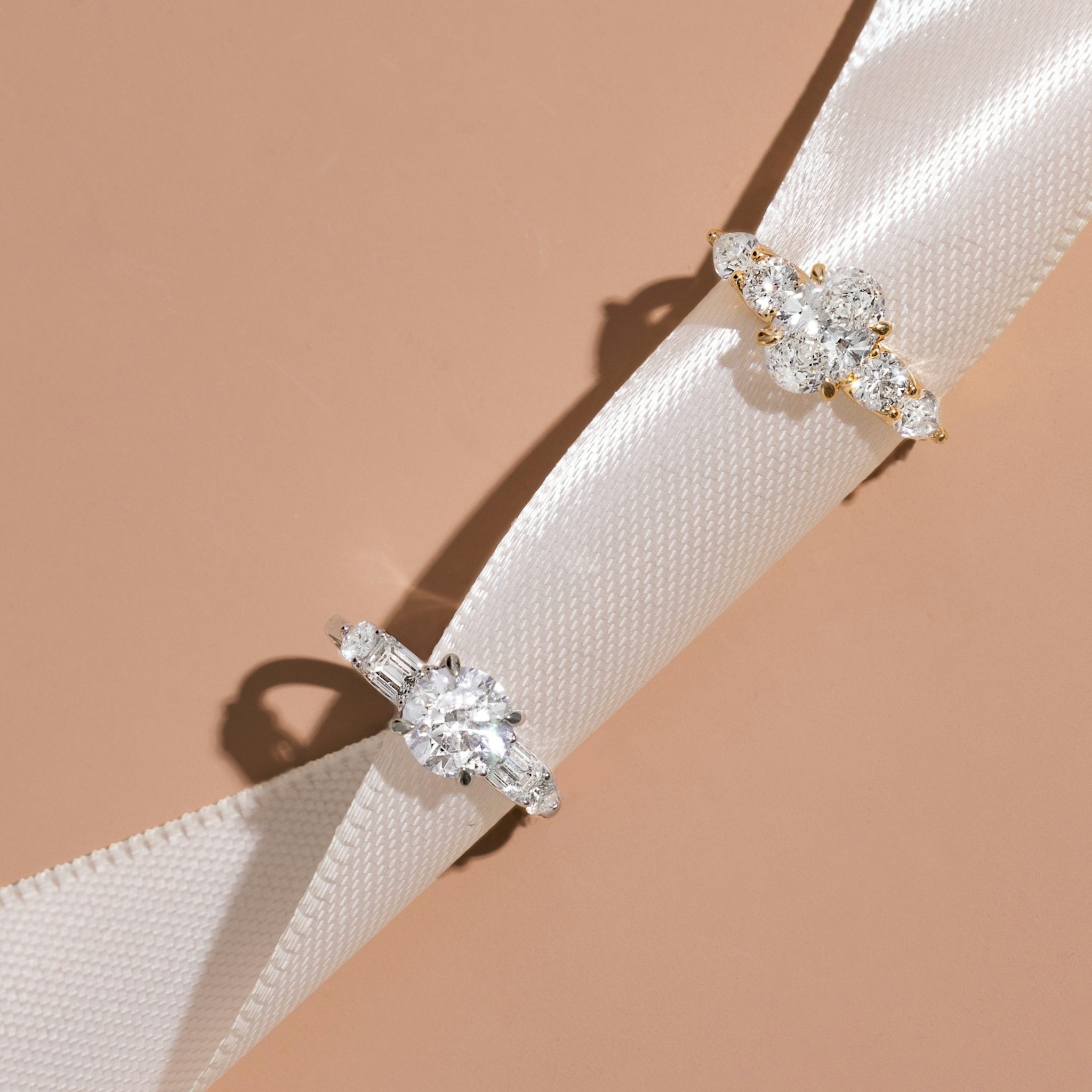 The Mixed Shape | Round Brilliant | Platinum | bandAccent: Plain | caratWeight: 1.0ct | sideStoneOrientation: horizontal | sideStoneShape: Round Brilliant and Pear | diamondOrientation: vertical