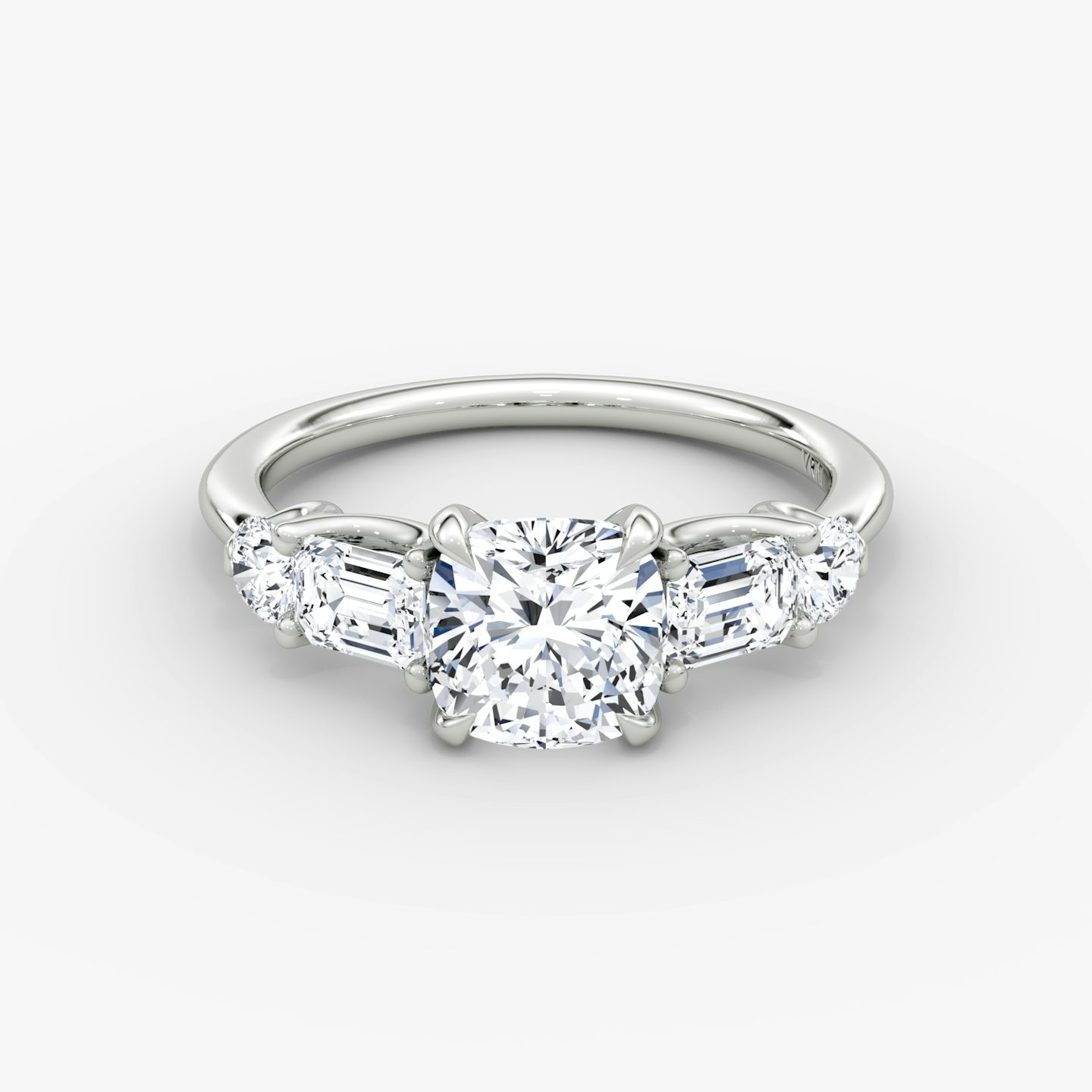 The Mixed Shape | Cushion | Platinum | bandAccent: Plain | sideStoneOrientation: horizontal | sideStoneShape: Emerald and Round Brilliant | diamondOrientation: vertical | caratWeight: other