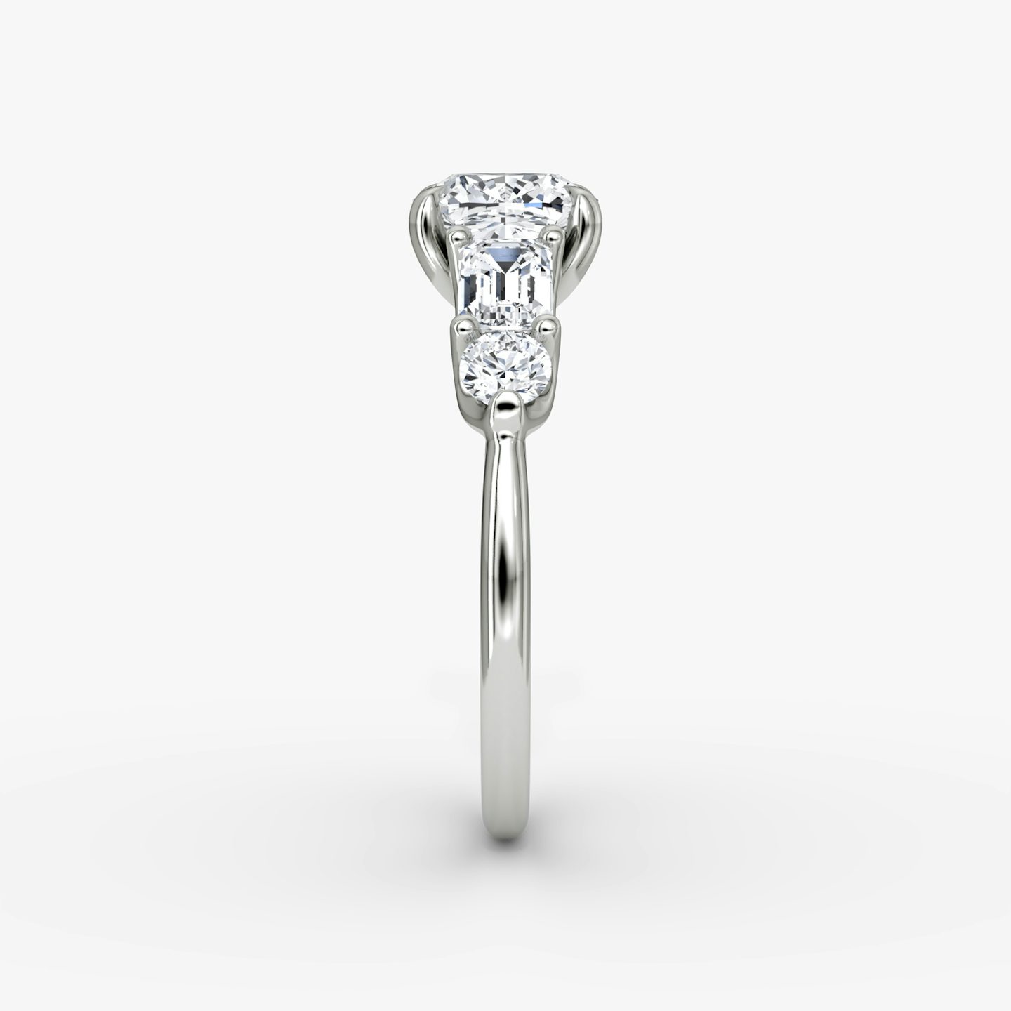 The Mixed Shape | Cushion | Platinum | bandAccent: Plain | sideStoneOrientation: horizontal | sideStoneShape: Emerald and Round Brilliant | diamondOrientation: vertical | caratWeight: other