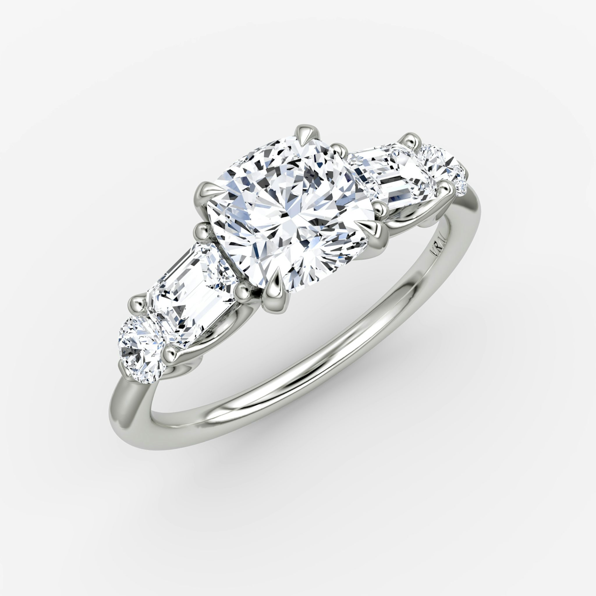 The Mixed Shape | Cushion | 18k | White Gold | bandAccent: Plain | sideStoneOrientation: horizontal | sideStoneShape: Emerald and Round Brilliant | diamondOrientation: vertical | caratWeight: other