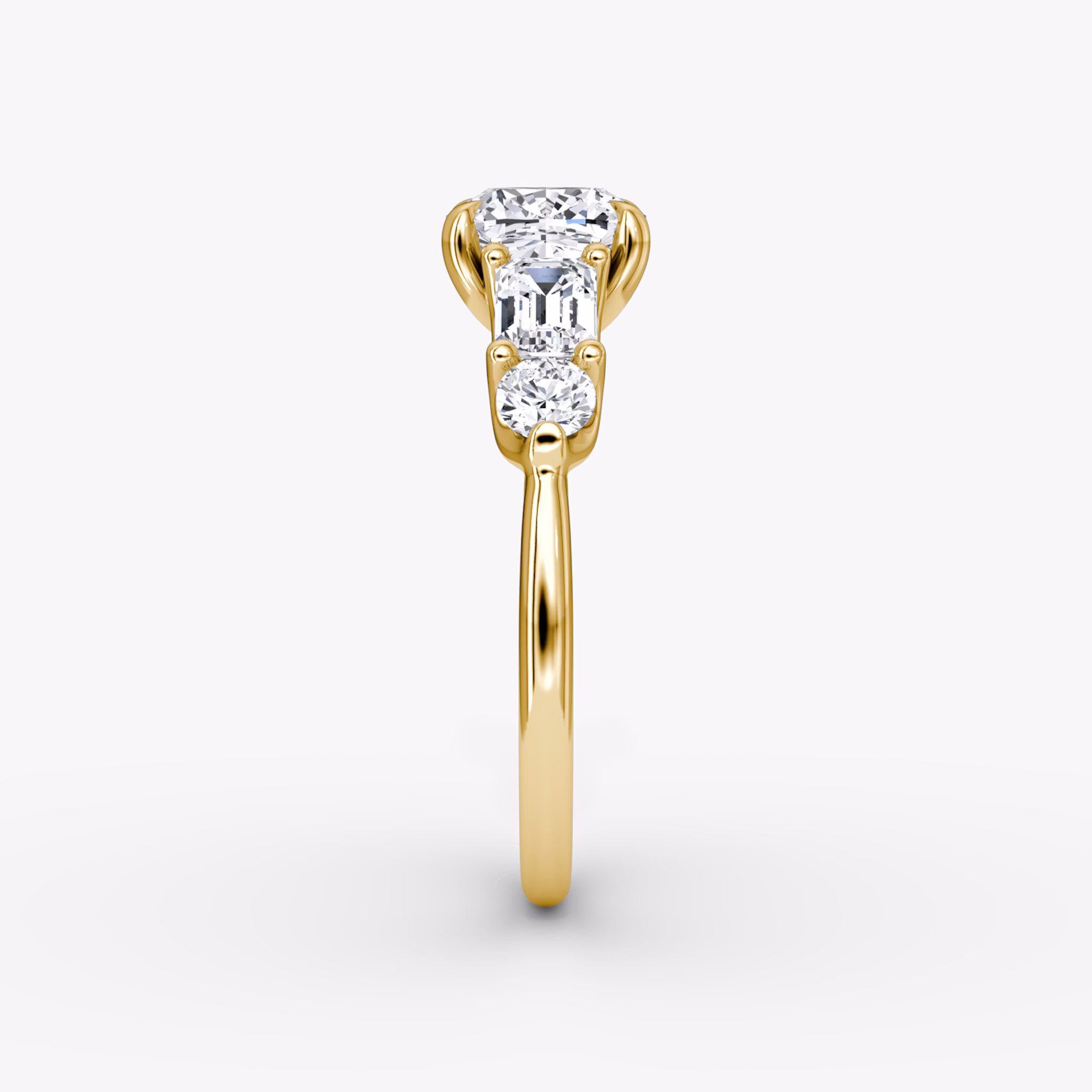 The Mixed Shape | Cushion | 18k | Yellow Gold | bandAccent: Plain | sideStoneOrientation: horizontal | sideStoneShape: Emerald and Round Brilliant | diamondOrientation: vertical | caratWeight: other