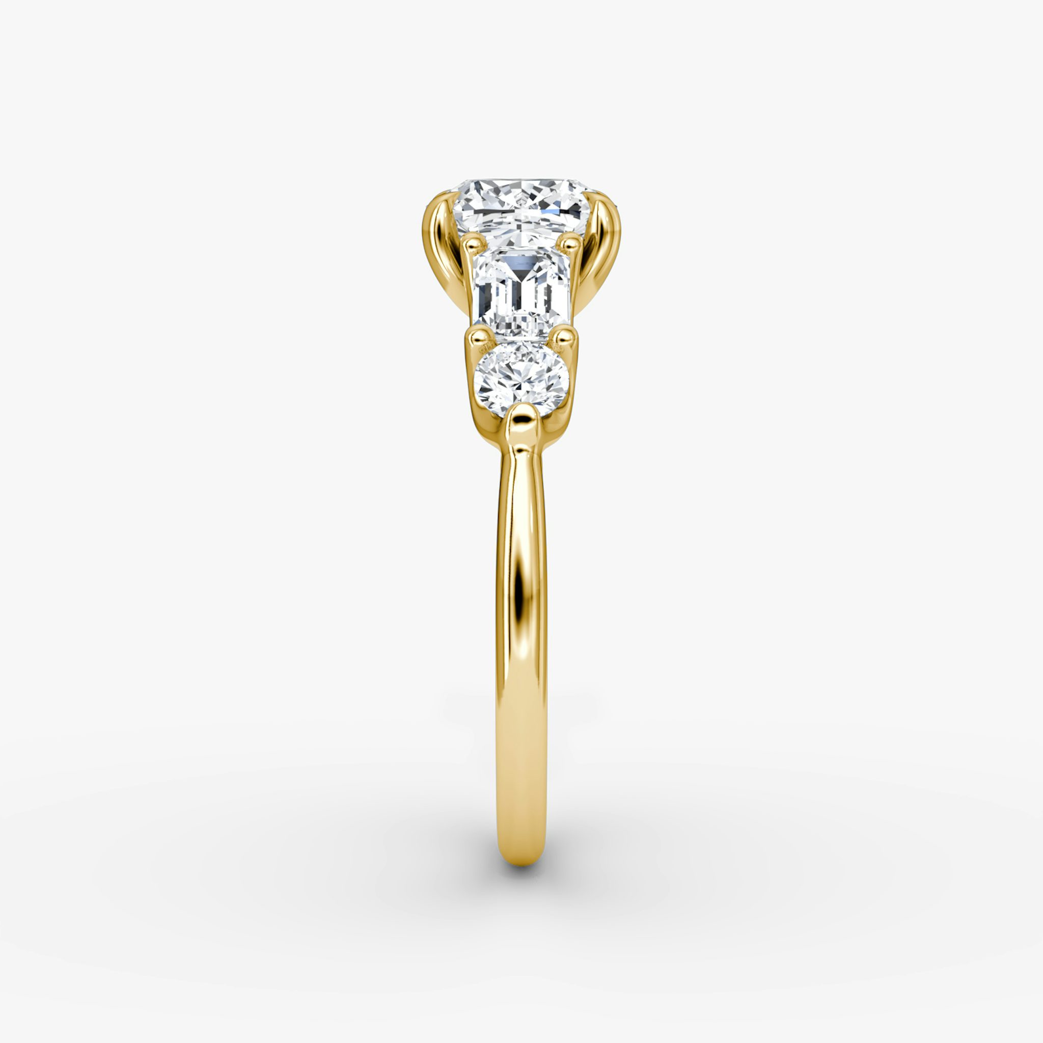 The Mixed Shape | Cushion | 18k | Yellow Gold | bandAccent: Plain | sideStoneOrientation: horizontal | sideStoneShape: Emerald and Round Brilliant | diamondOrientation: vertical | caratWeight: other