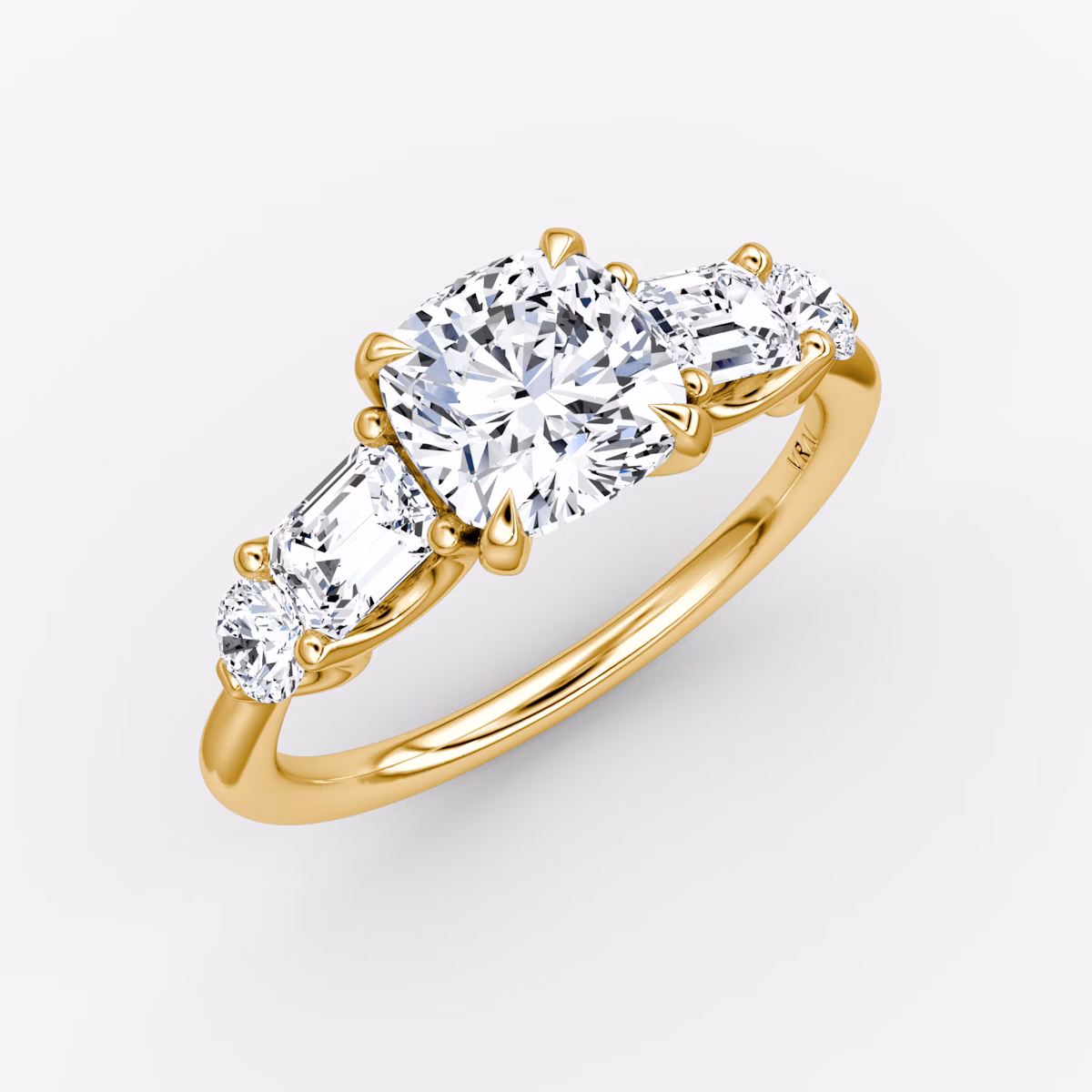 The Mixed Shape | Cushion | 18k | Yellow Gold | bandAccent: Plain | sideStoneOrientation: horizontal | sideStoneShape: Emerald and Round Brilliant | diamondOrientation: vertical | caratWeight: other