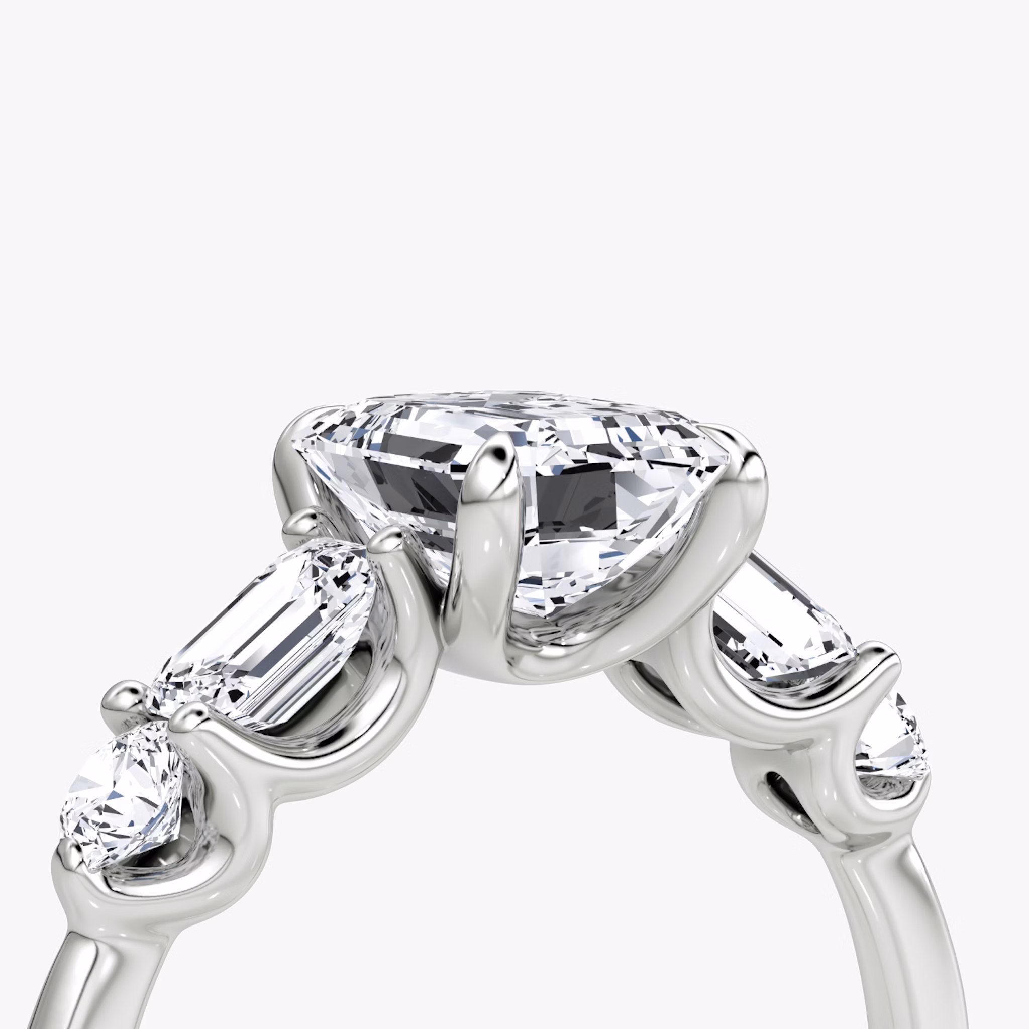 The Mixed Shape | Emerald | 18k | White Gold | bandAccent: Plain | sideStoneOrientation: horizontal | sideStoneShape: Emerald and Round Brilliant | diamondOrientation: vertical | caratWeight: other