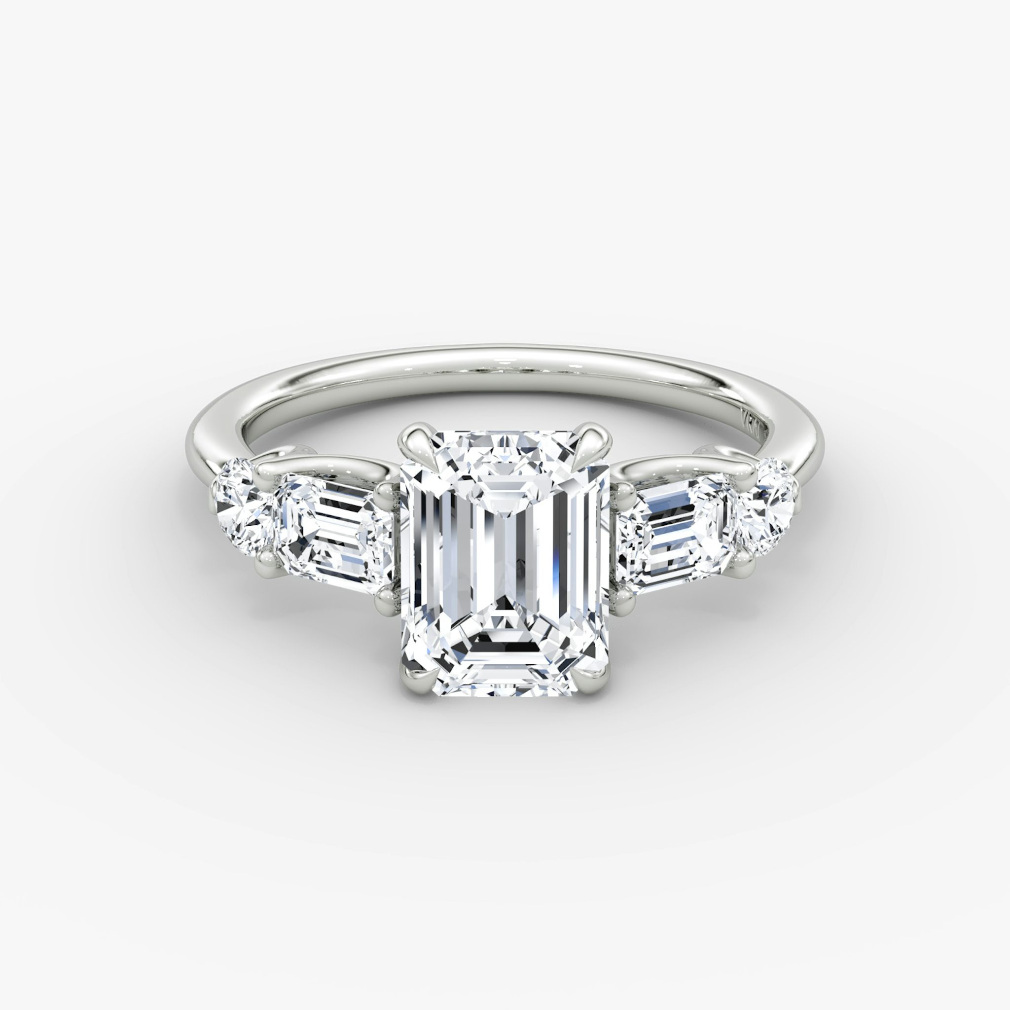 The Mixed Shape | Emerald | 18k | White Gold | bandAccent: Plain | sideStoneOrientation: horizontal | sideStoneShape: Emerald and Round Brilliant | diamondOrientation: vertical | caratWeight: other