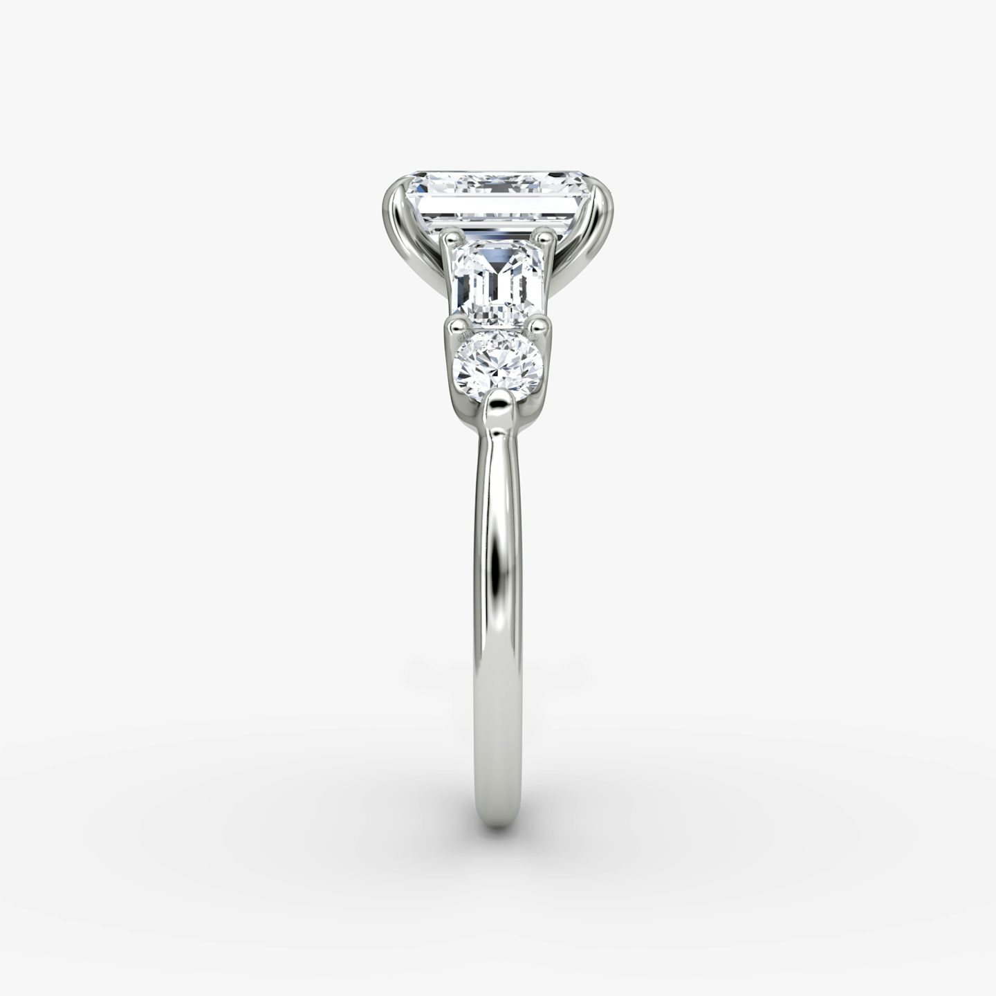 The Mixed Shape | Emerald | Platinum | bandAccent: Plain | sideStoneOrientation: horizontal | sideStoneShape: Emerald and Round Brilliant | diamondOrientation: vertical | caratWeight: other
