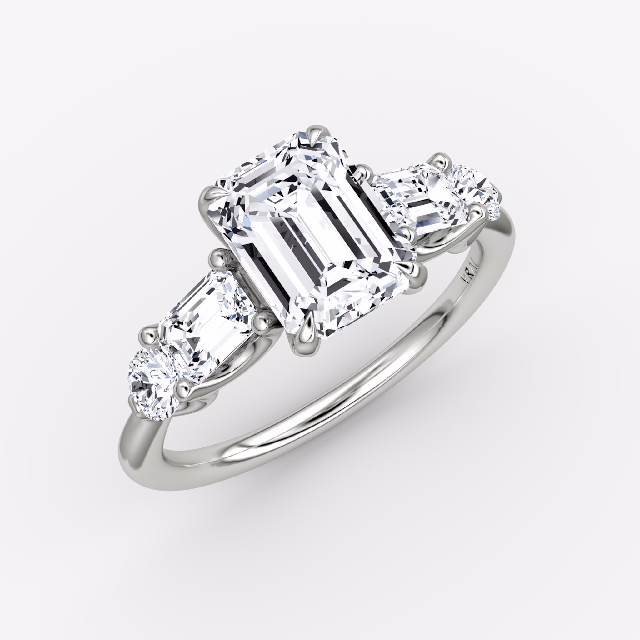 The Mixed Shape | Emerald | 18k | White Gold | bandAccent: Plain | sideStoneOrientation: horizontal | sideStoneShape: Emerald and Round Brilliant | diamondOrientation: vertical | caratWeight: other