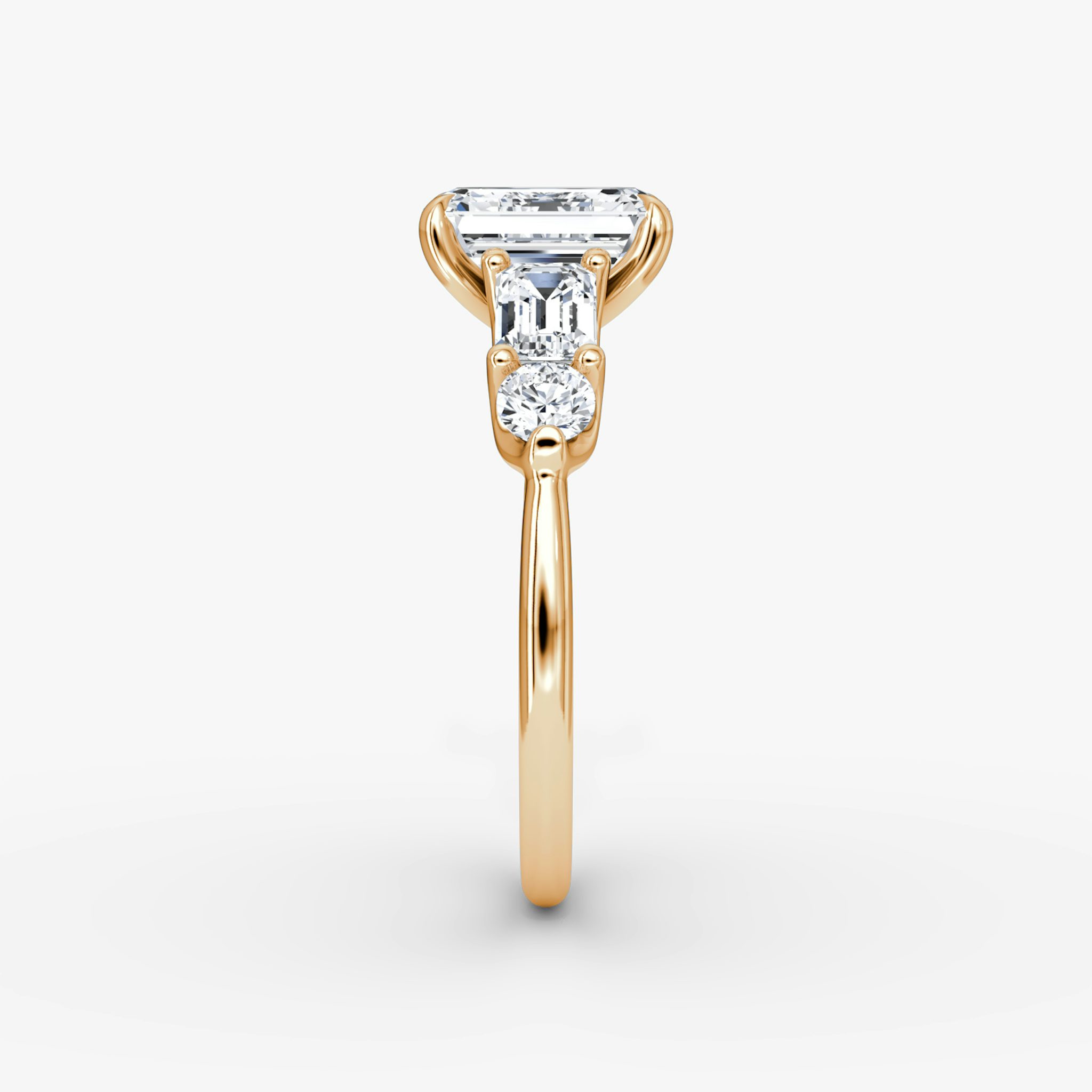 The Mixed Shape | Emerald | 14k | Rose Gold | bandAccent: Plain | sideStoneOrientation: horizontal | sideStoneShape: Emerald and Round Brilliant | diamondOrientation: vertical | caratWeight: other