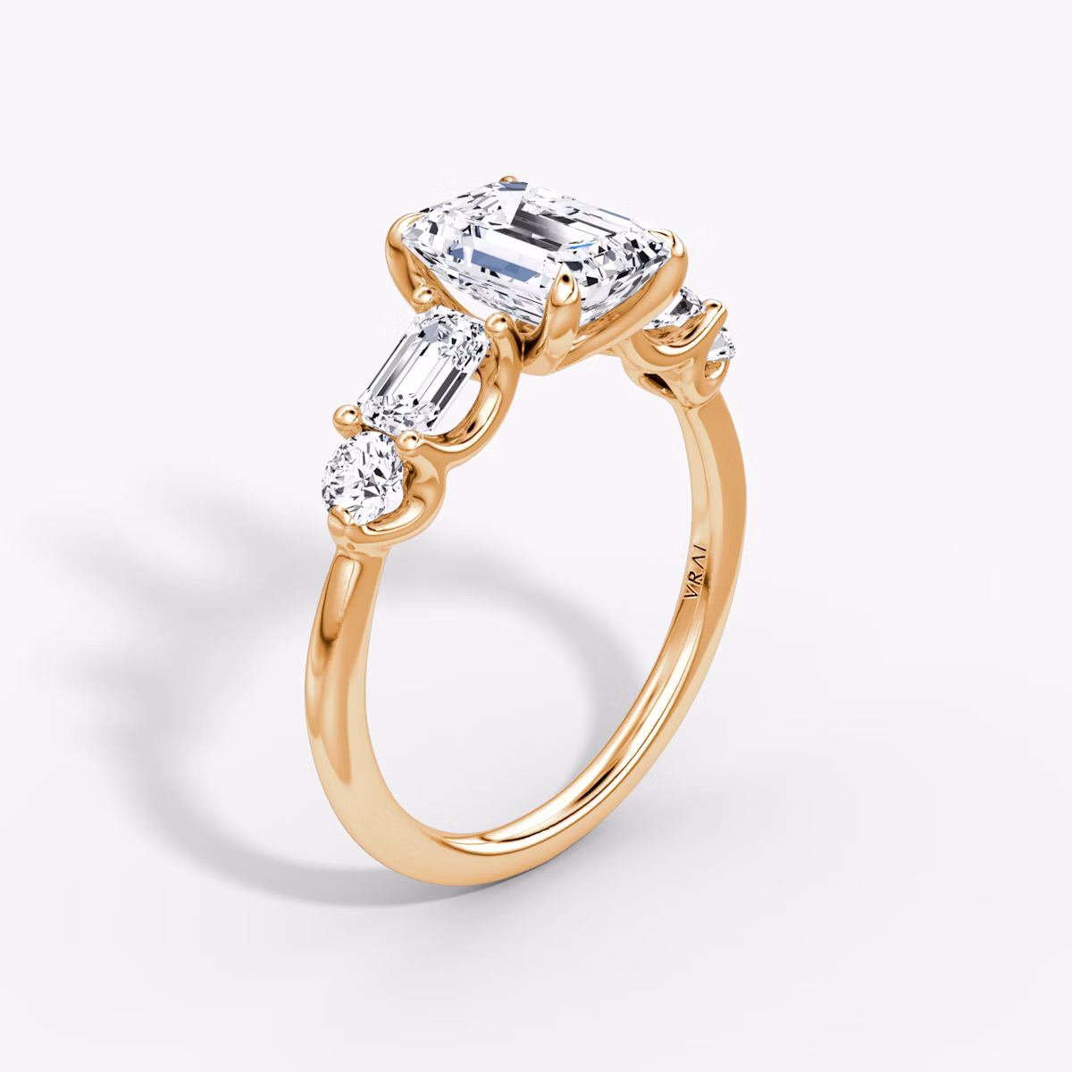 The Mixed Shape | Emerald | 14k | Rose Gold | bandAccent: Plain | sideStoneOrientation: horizontal | sideStoneShape: Emerald and Round Brilliant | diamondOrientation: vertical | caratWeight: other