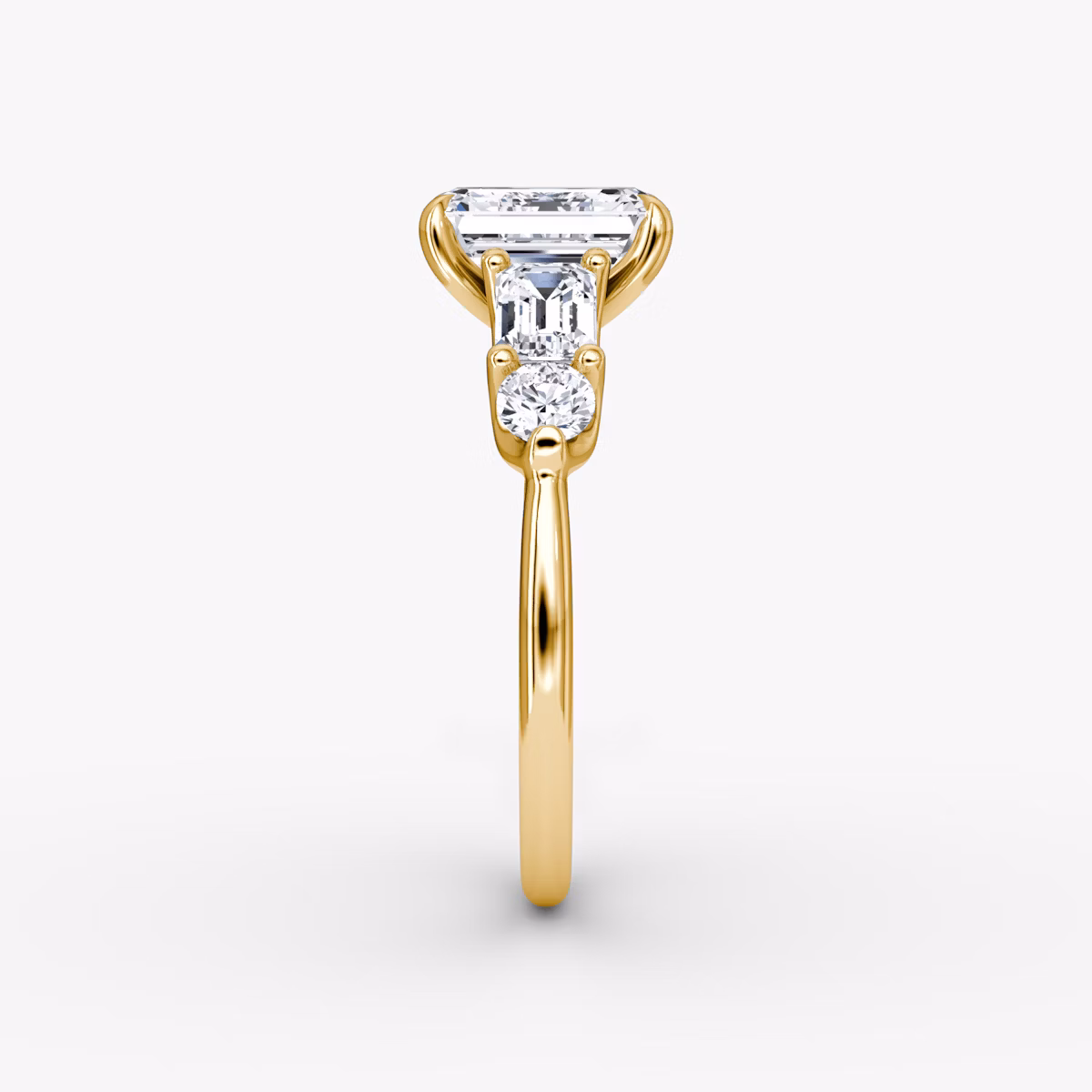 The Mixed Shape | Emerald | 18k | Yellow Gold | bandAccent: Plain | sideStoneOrientation: horizontal | sideStoneShape: Emerald and Round Brilliant | diamondOrientation: vertical | caratWeight: other