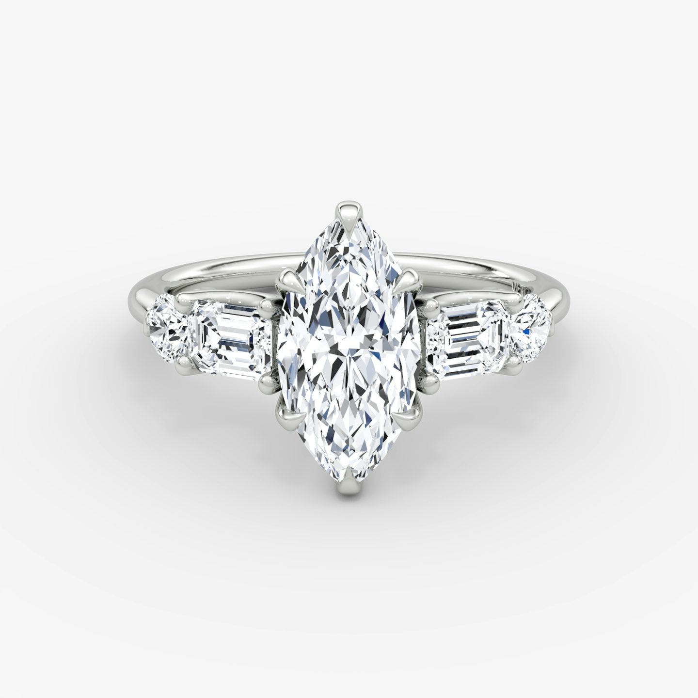 The Mixed Shape | Marquise | Platinum | bandAccent: Plain | sideStoneOrientation: horizontal | sideStoneShape: Emerald and Round Brilliant | diamondOrientation: vertical | caratWeight: other