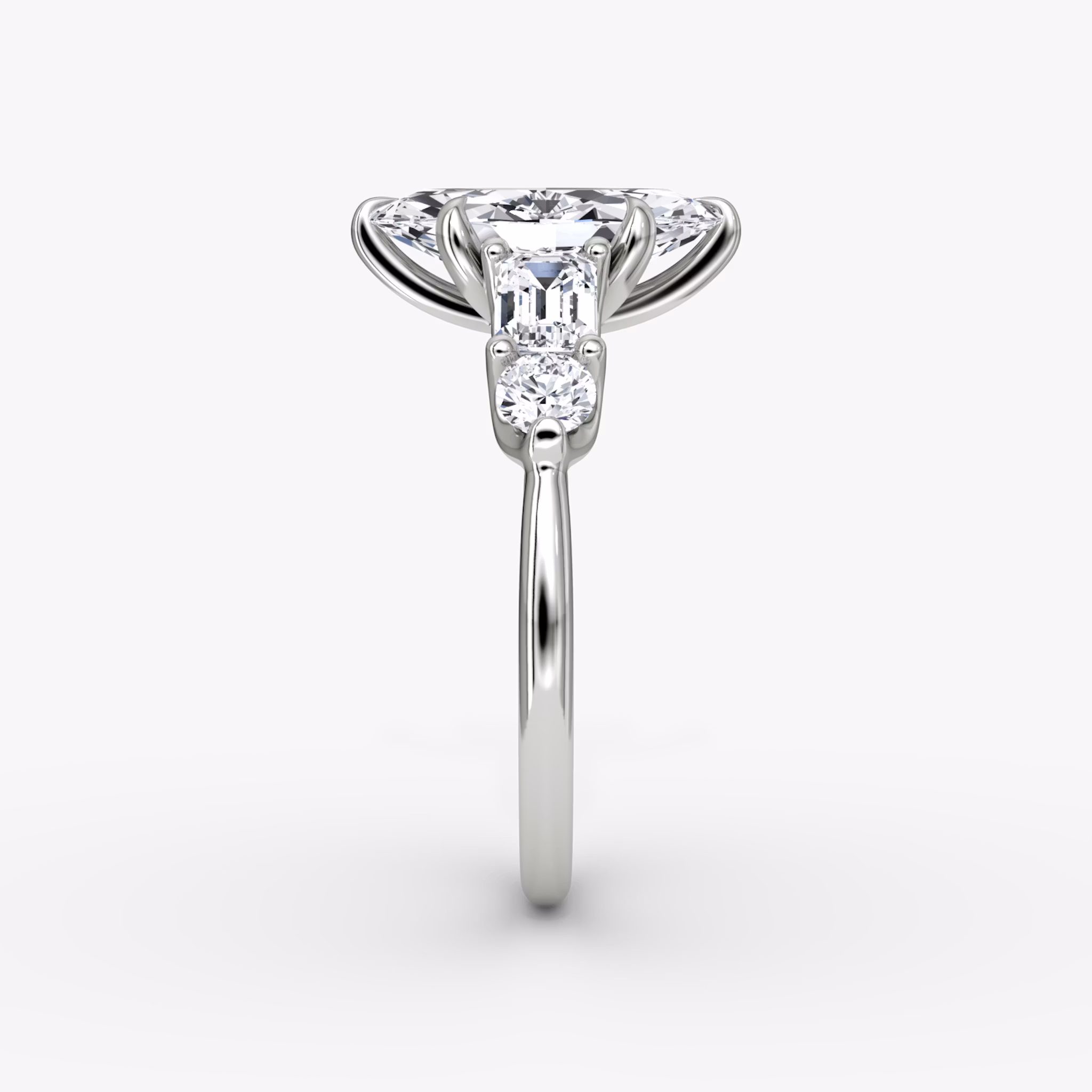 The Mixed Shape | Marquise | 18k | White Gold | bandAccent: Plain | sideStoneOrientation: horizontal | sideStoneShape: Emerald and Round Brilliant | diamondOrientation: vertical | caratWeight: other