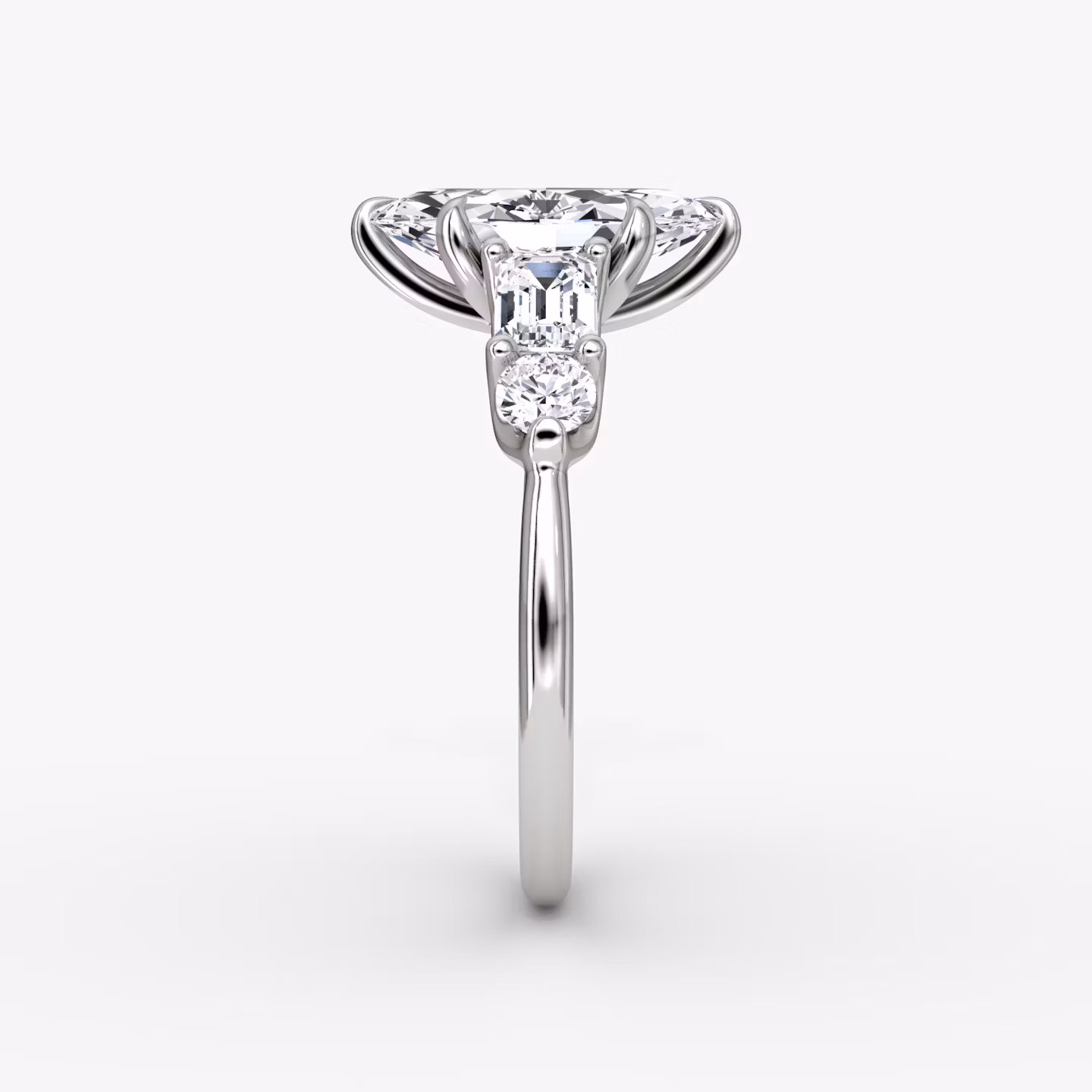 The Mixed Shape | Marquise | Platinum | bandAccent: Plain | sideStoneOrientation: horizontal | sideStoneShape: Emerald and Round Brilliant | diamondOrientation: vertical | caratWeight: other