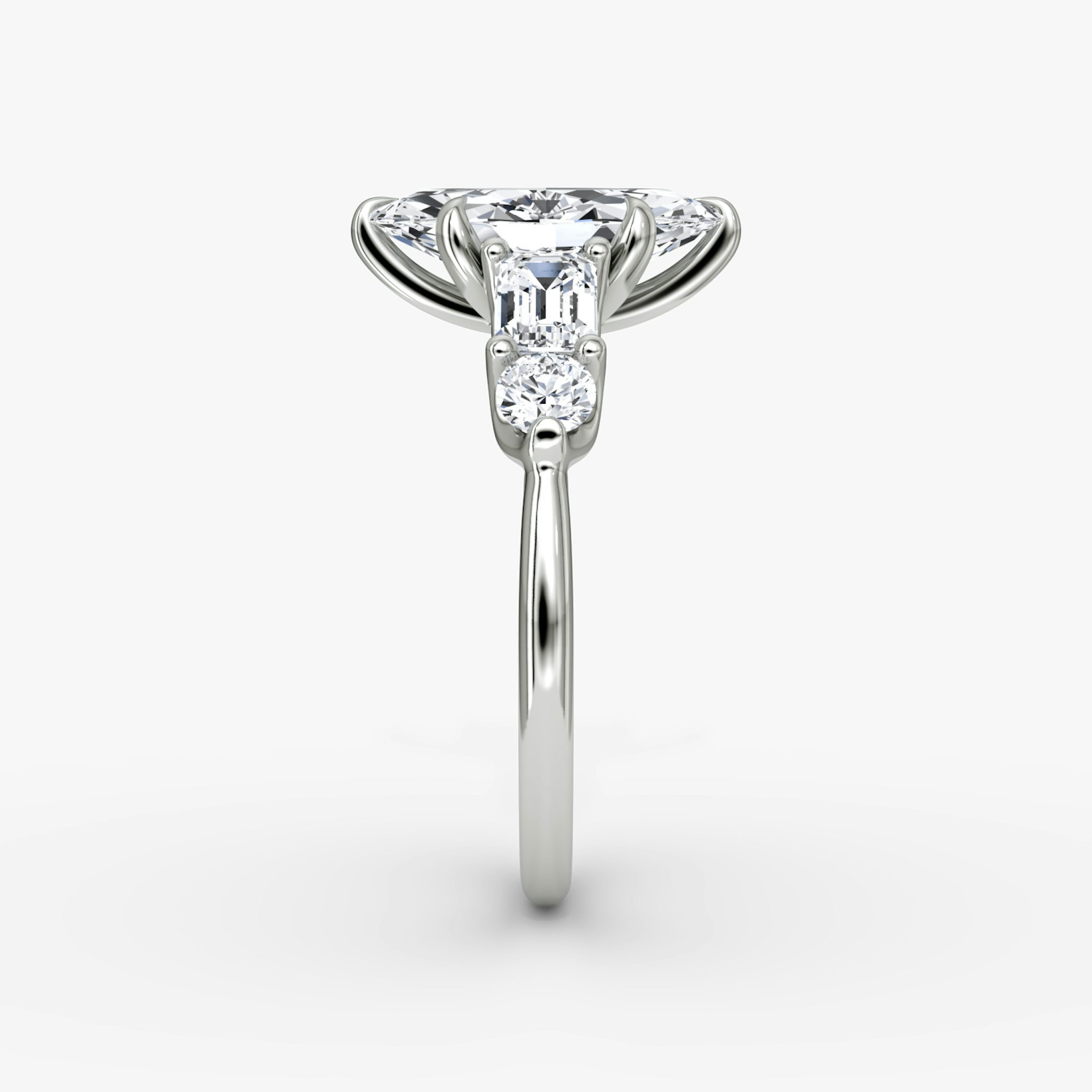 The Mixed Shape | Marquise | 18k | White Gold | bandAccent: Plain | sideStoneOrientation: horizontal | sideStoneShape: Emerald and Round Brilliant | diamondOrientation: vertical | caratWeight: other