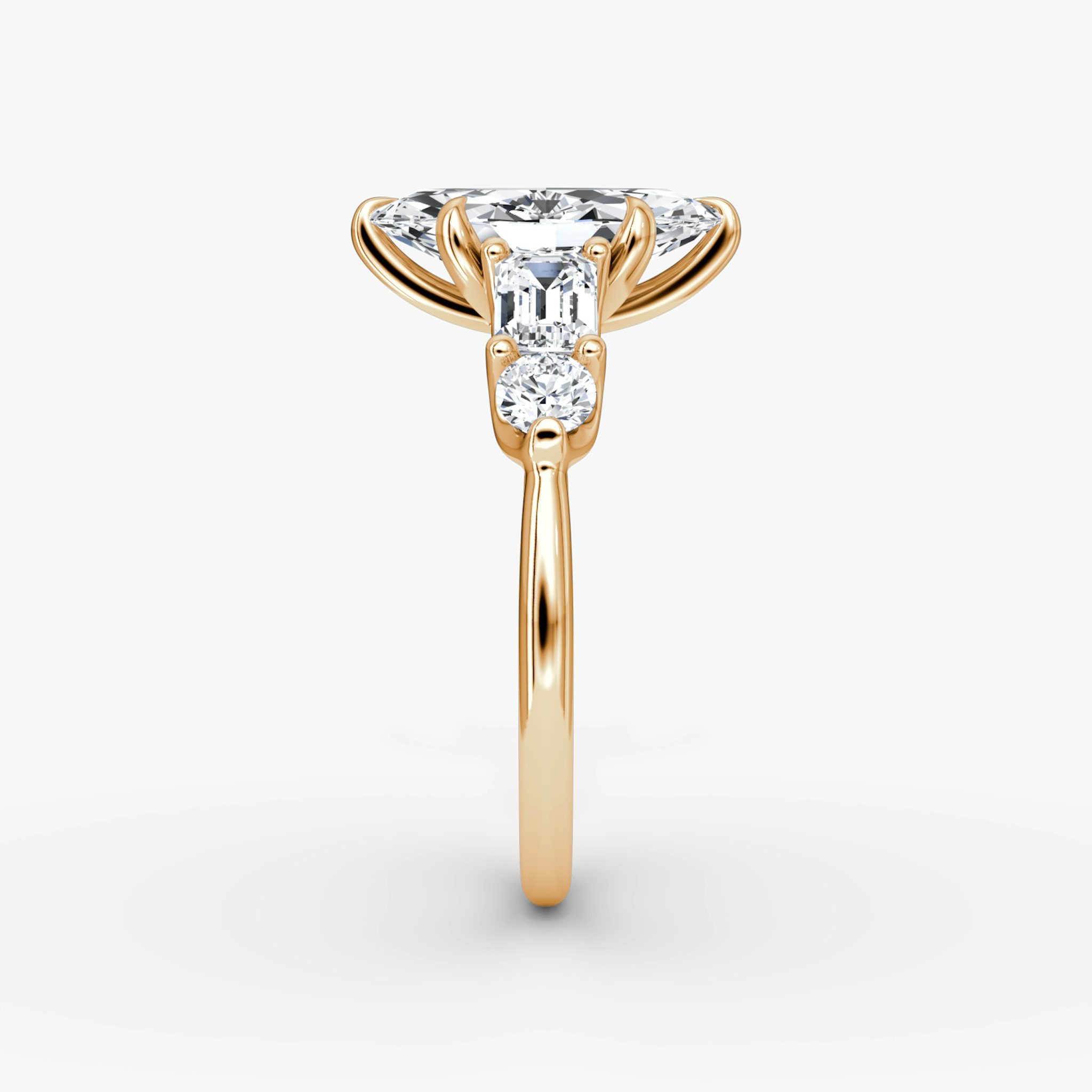 The Mixed Shape | Marquise | 14k | Rose Gold | bandAccent: Plain | sideStoneOrientation: horizontal | sideStoneShape: Emerald and Round Brilliant | diamondOrientation: vertical | caratWeight: other