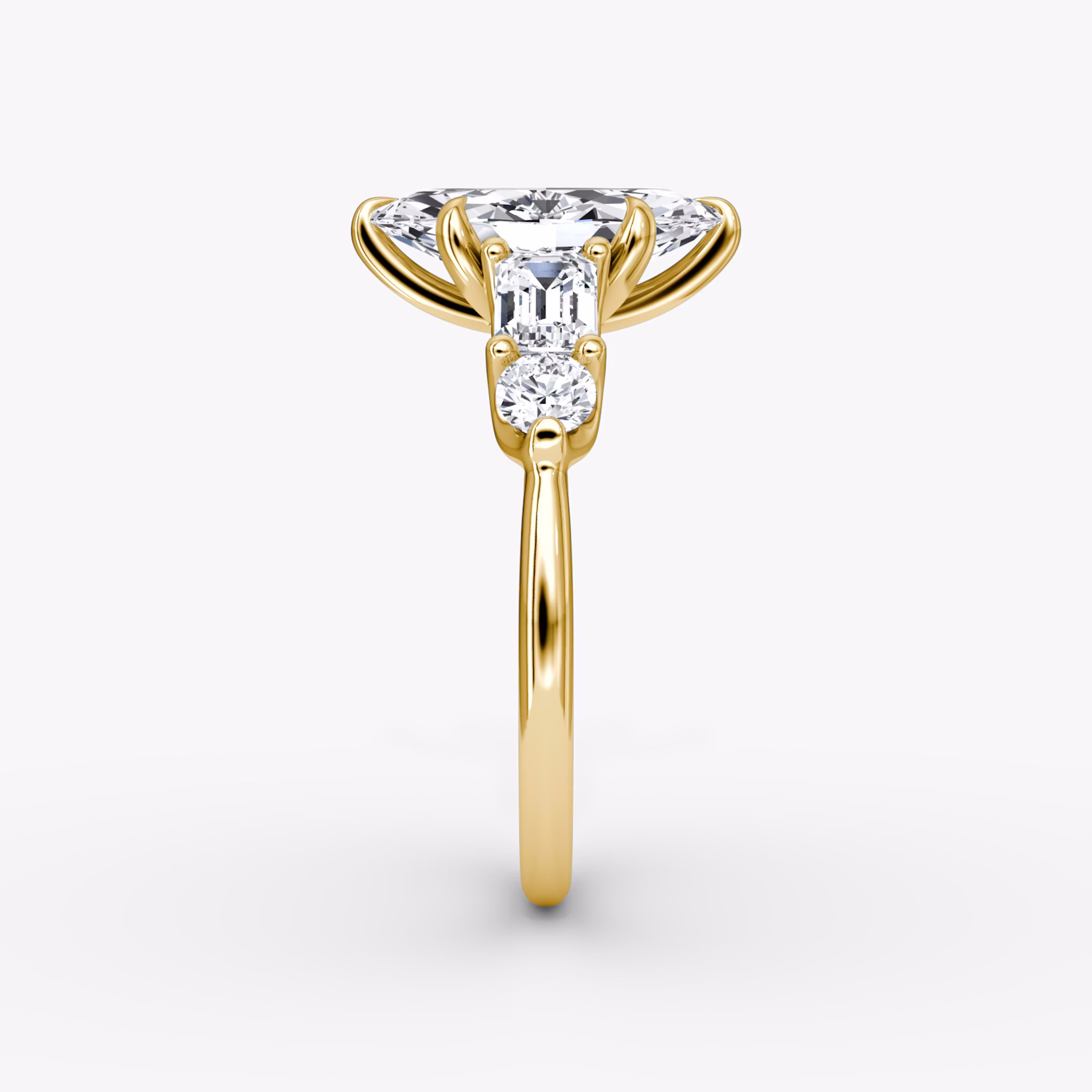 The Mixed Shape | Marquise | 18k | Yellow Gold | bandAccent: Plain | sideStoneOrientation: horizontal | sideStoneShape: Emerald and Round Brilliant | diamondOrientation: vertical | caratWeight: other