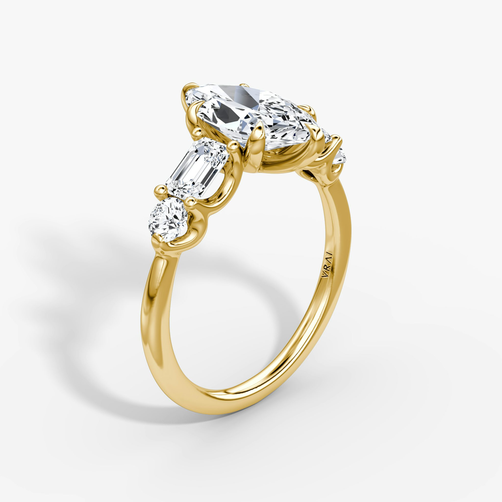 The Mixed Shape | Marquise | 18k | Yellow Gold | bandAccent: Plain | sideStoneOrientation: horizontal | sideStoneShape: Emerald and Round Brilliant | diamondOrientation: vertical | caratWeight: other