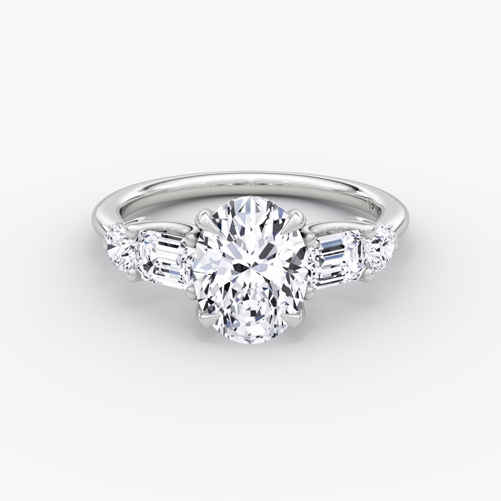 The Mixed Shape | Oval | 18k | White Gold | bandAccent: Plain | sideStoneOrientation: horizontal | sideStoneShape: Emerald and Round Brilliant | diamondOrientation: vertical | caratWeight: other