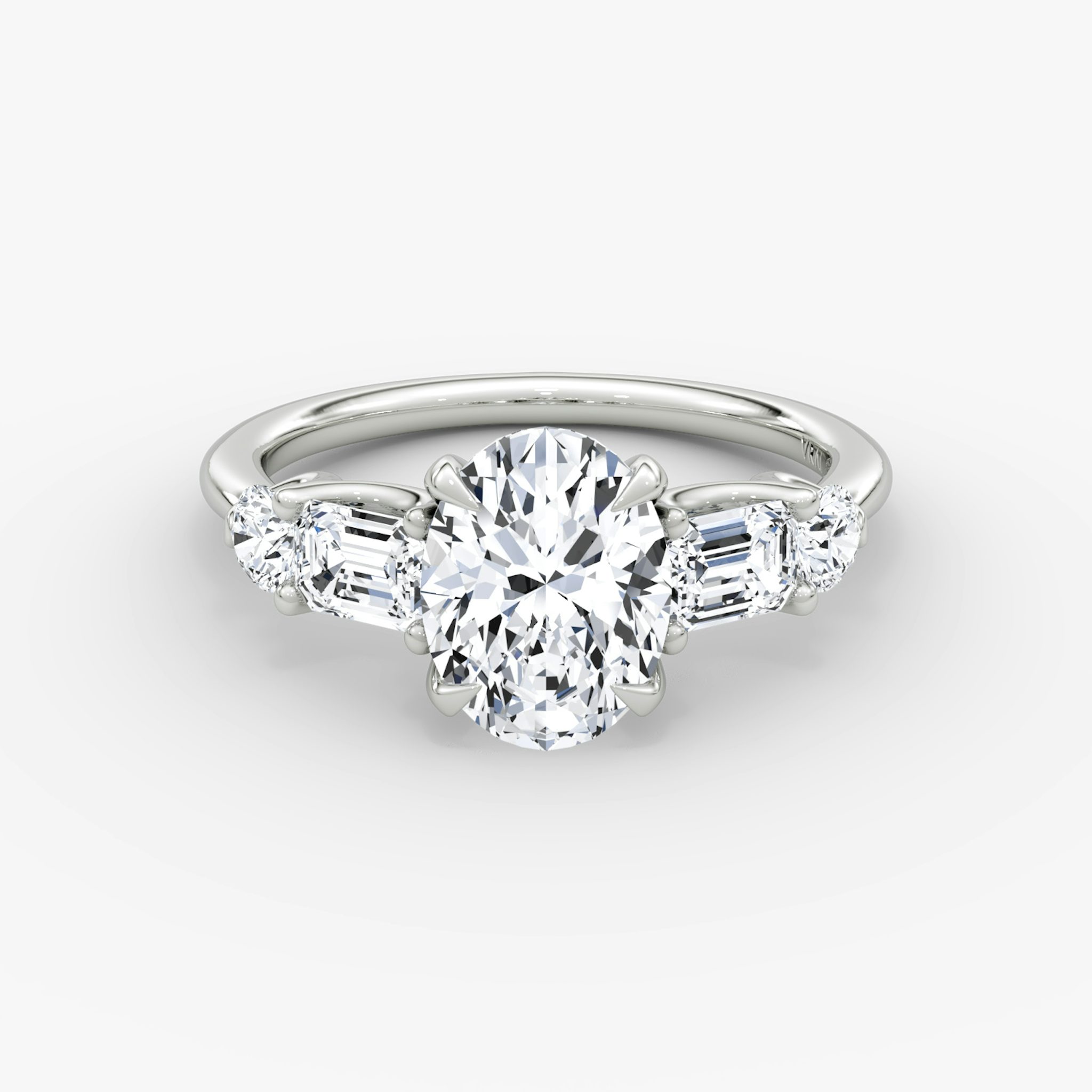 The Mixed Shape | Oval | 18k | White Gold | bandAccent: Plain | sideStoneOrientation: horizontal | sideStoneShape: Emerald and Round Brilliant | diamondOrientation: vertical | caratWeight: other