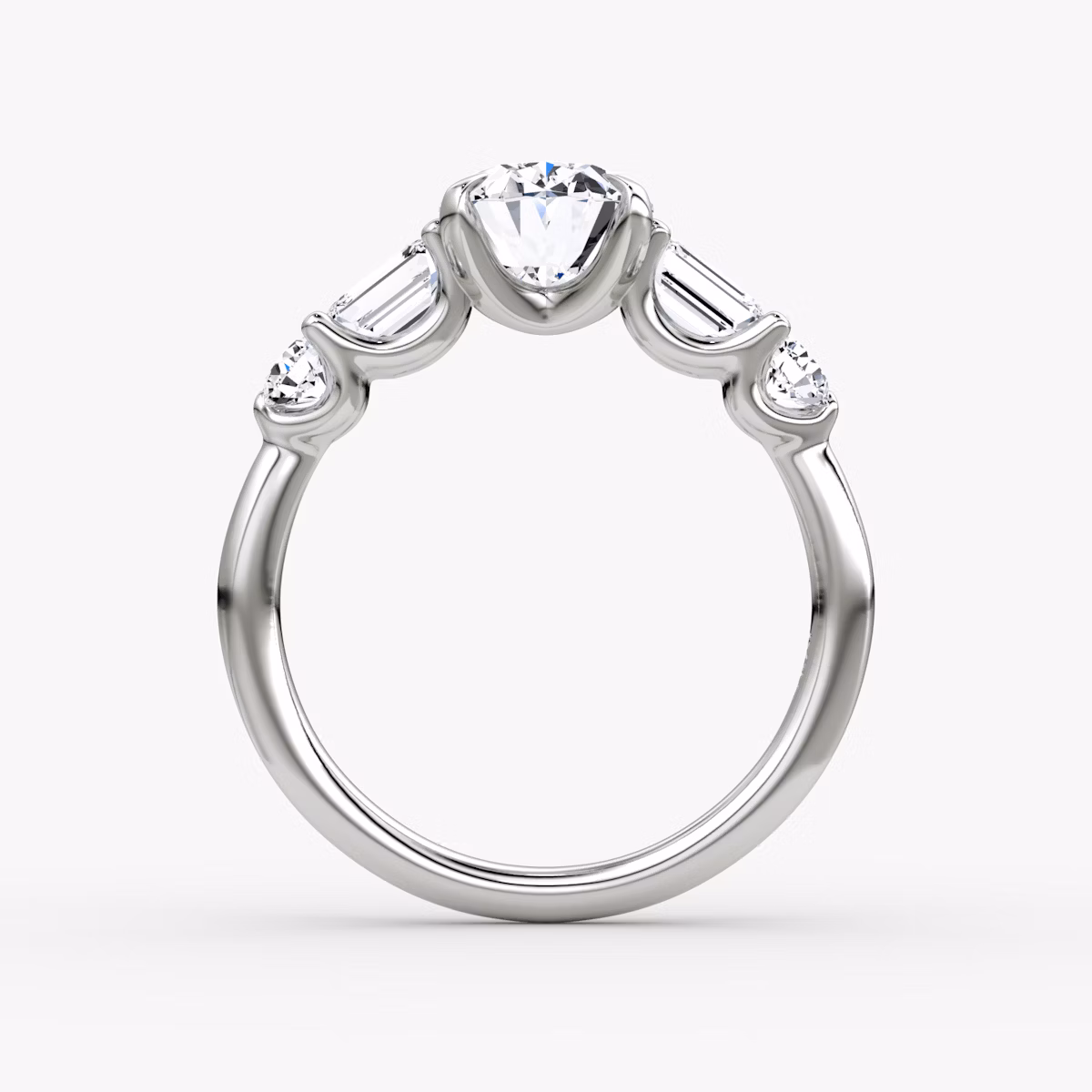 The Mixed Shape | Oval | Platinum | bandAccent: Plain | sideStoneOrientation: horizontal | sideStoneShape: Emerald and Round Brilliant | diamondOrientation: vertical | caratWeight: other