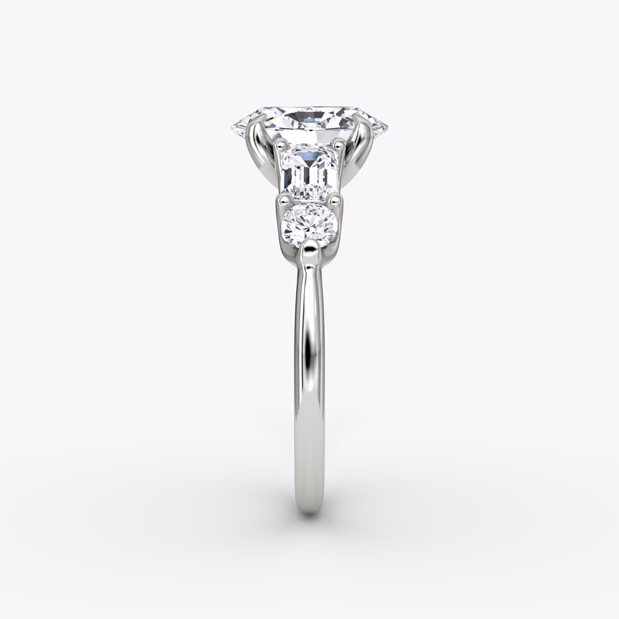 The Mixed Shape | Oval | 18k | White Gold | bandAccent: Plain | sideStoneOrientation: horizontal | sideStoneShape: Emerald and Round Brilliant | diamondOrientation: vertical | caratWeight: other