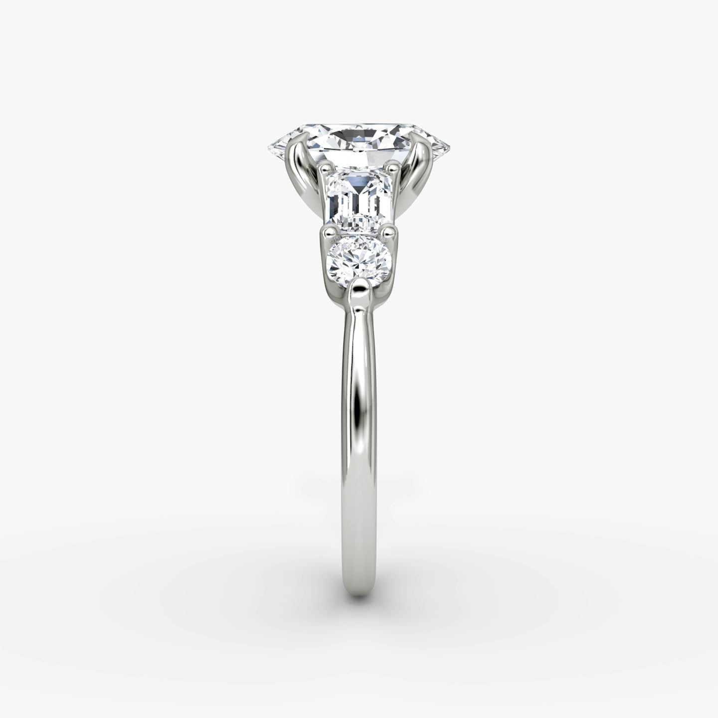 The Mixed Shape | Oval | Platinum | bandAccent: Plain | sideStoneOrientation: horizontal | sideStoneShape: Emerald and Round Brilliant | diamondOrientation: vertical | caratWeight: other