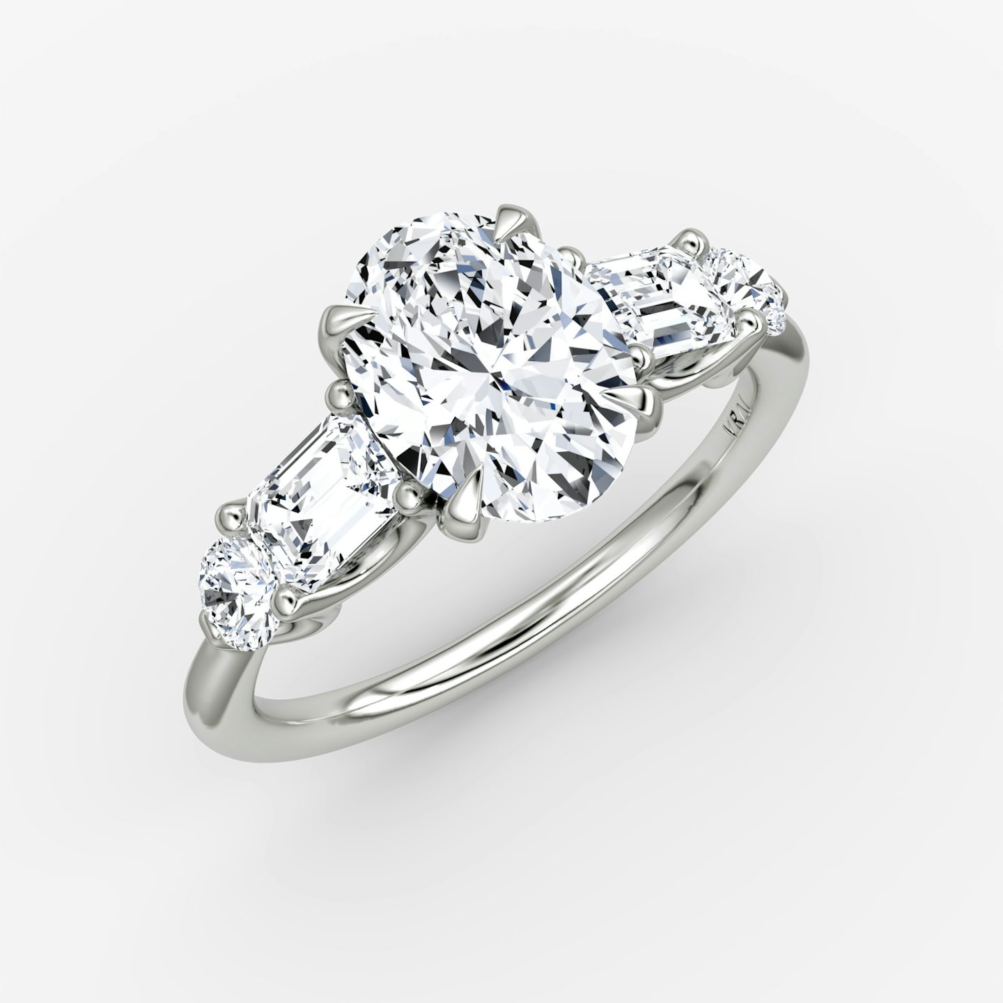 The Mixed Shape | Oval | Platinum | bandAccent: Plain | sideStoneOrientation: horizontal | sideStoneShape: Emerald and Round Brilliant | diamondOrientation: vertical | caratWeight: other