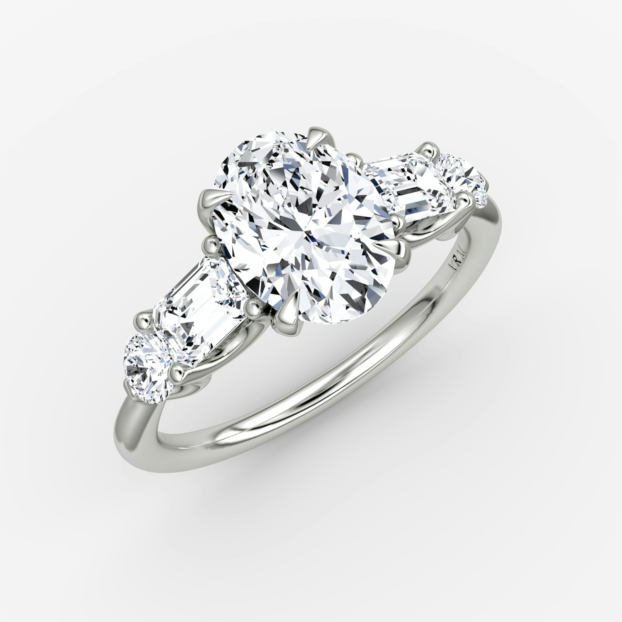 The Mixed Shape | Oval | 18k | White Gold | bandAccent: Plain | sideStoneOrientation: horizontal | sideStoneShape: Emerald and Round Brilliant | diamondOrientation: vertical | caratWeight: other