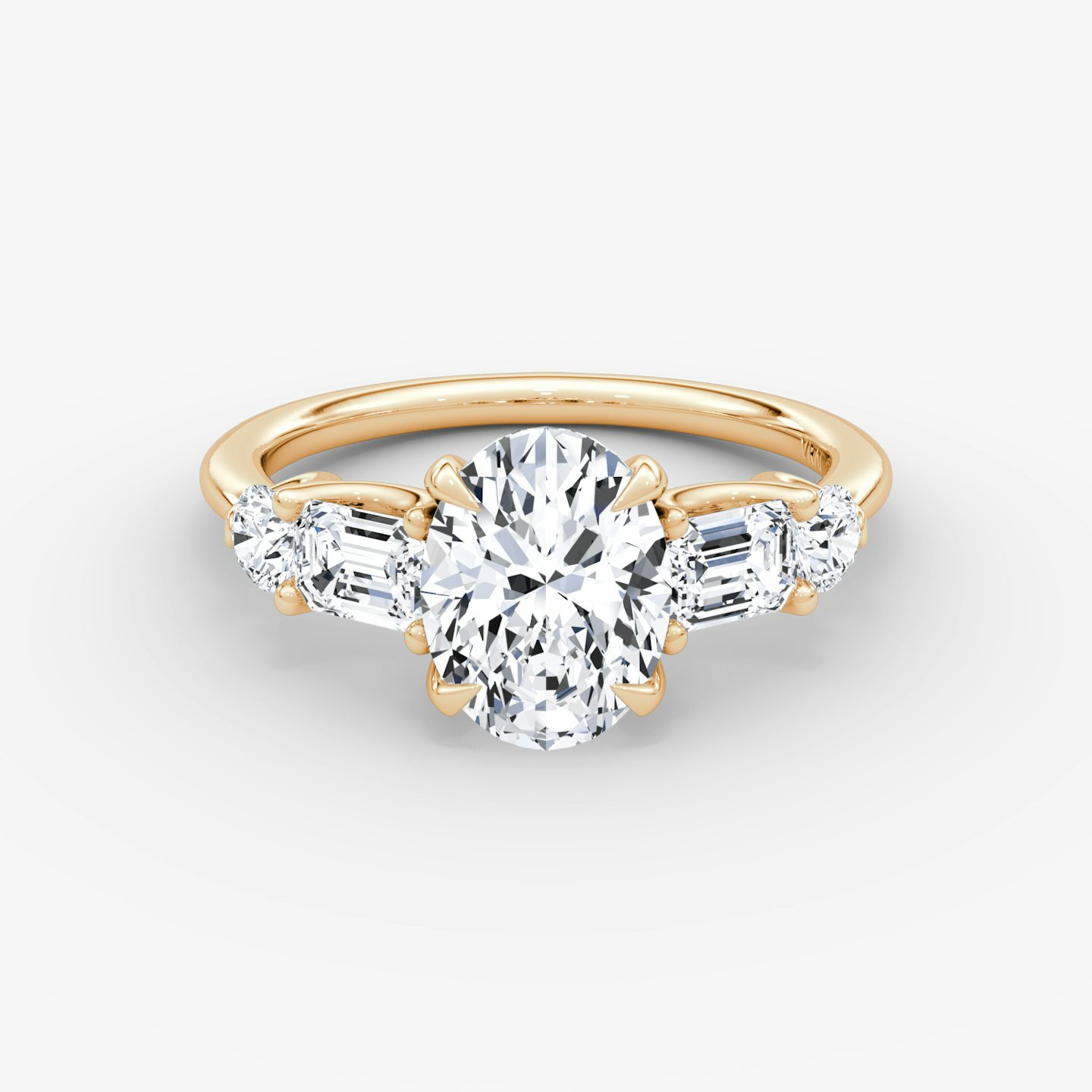 The Mixed Shape | Oval | 14k | Rose Gold | bandAccent: Plain | sideStoneOrientation: horizontal | sideStoneShape: Emerald and Round Brilliant | diamondOrientation: vertical | caratWeight: other