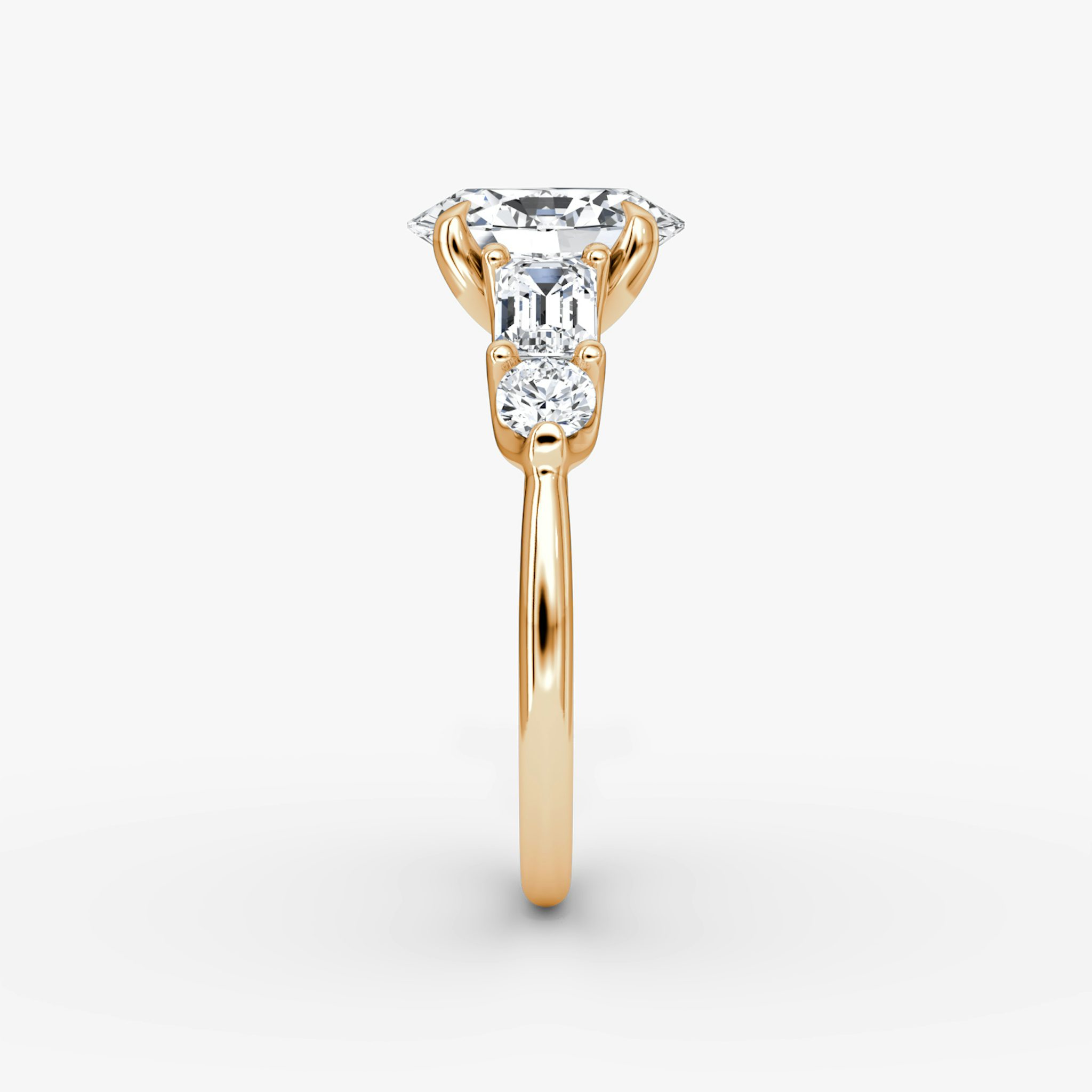 The Mixed Shape | Oval | 14k | Rose Gold | bandAccent: Plain | sideStoneOrientation: horizontal | sideStoneShape: Emerald and Round Brilliant | diamondOrientation: vertical | caratWeight: other