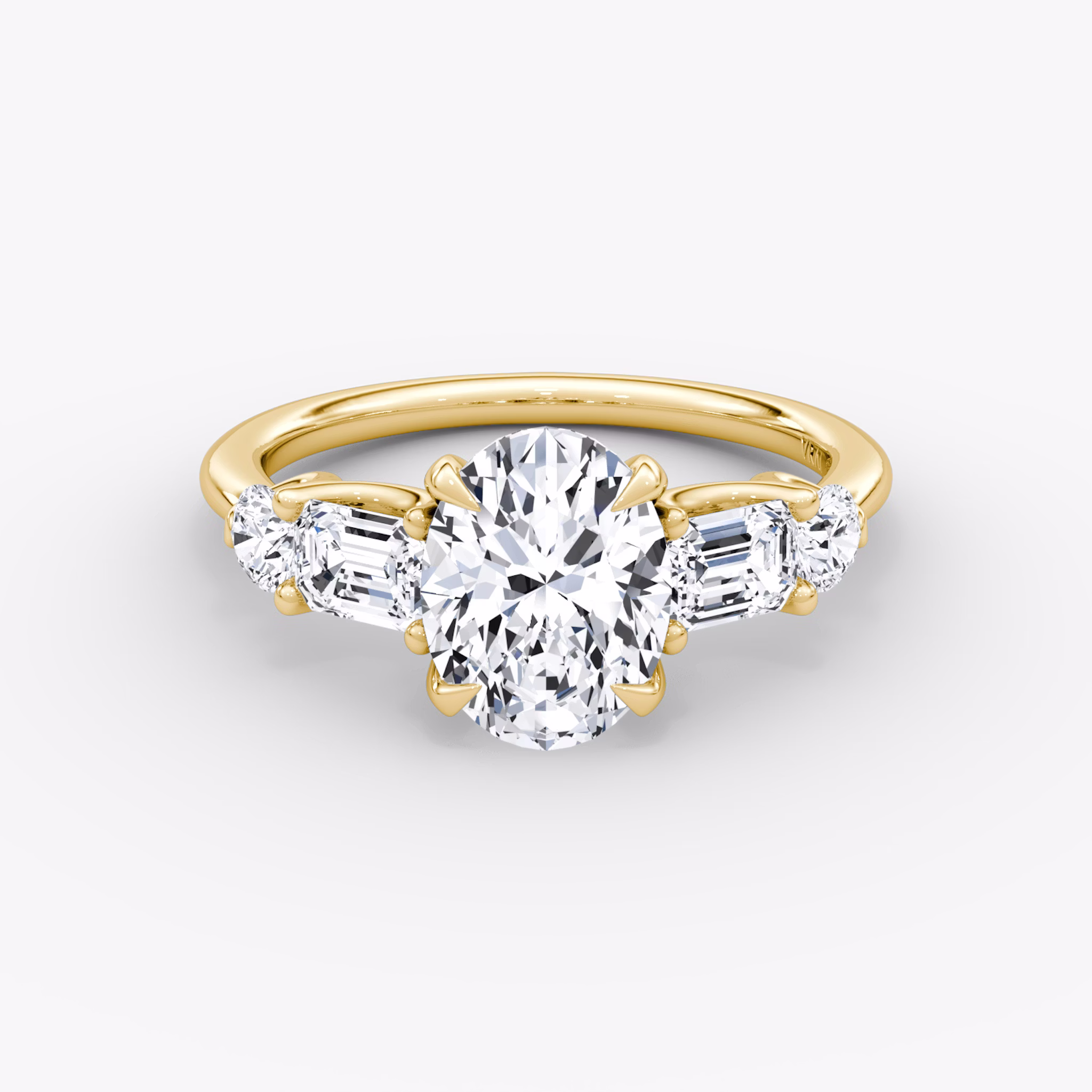 The Mixed Shape | Oval | 18k | Yellow Gold | bandAccent: Plain | sideStoneOrientation: horizontal | sideStoneShape: Emerald and Round Brilliant | diamondOrientation: vertical | caratWeight: other