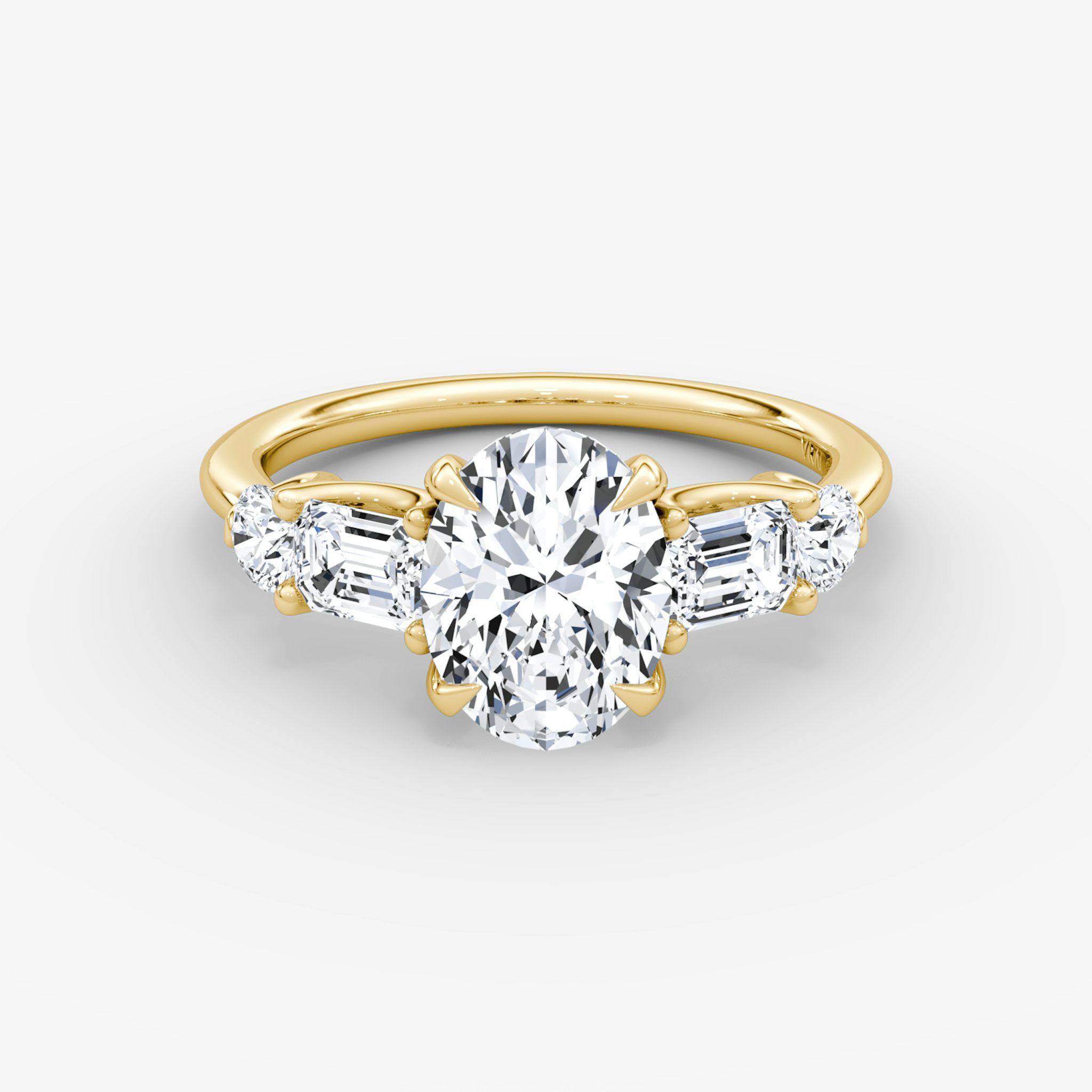 The Mixed Shape | Oval | 18k | Yellow Gold | bandAccent: Plain | sideStoneOrientation: horizontal | sideStoneShape: Emerald and Round Brilliant | diamondOrientation: vertical | caratWeight: other