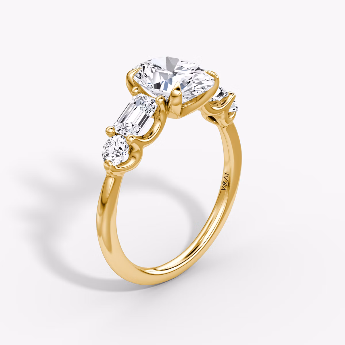 The Mixed Shape | Oval | 18k | Yellow Gold | bandAccent: Plain | sideStoneOrientation: horizontal | sideStoneShape: Emerald and Round Brilliant | diamondOrientation: vertical | caratWeight: other