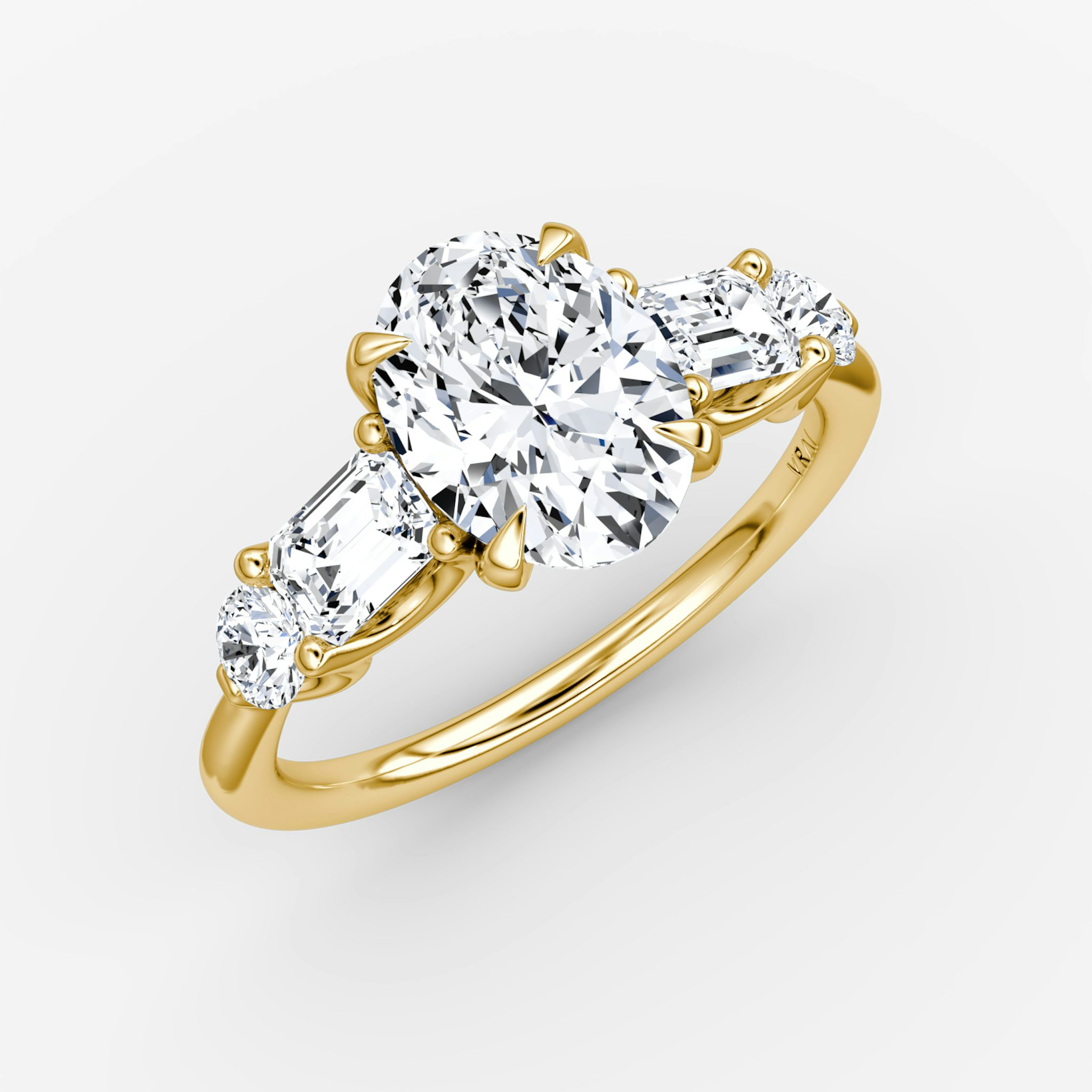 The Mixed Shape | Oval | 18k | Yellow Gold | bandAccent: Plain | sideStoneOrientation: horizontal | sideStoneShape: Emerald and Round Brilliant | diamondOrientation: vertical | caratWeight: other