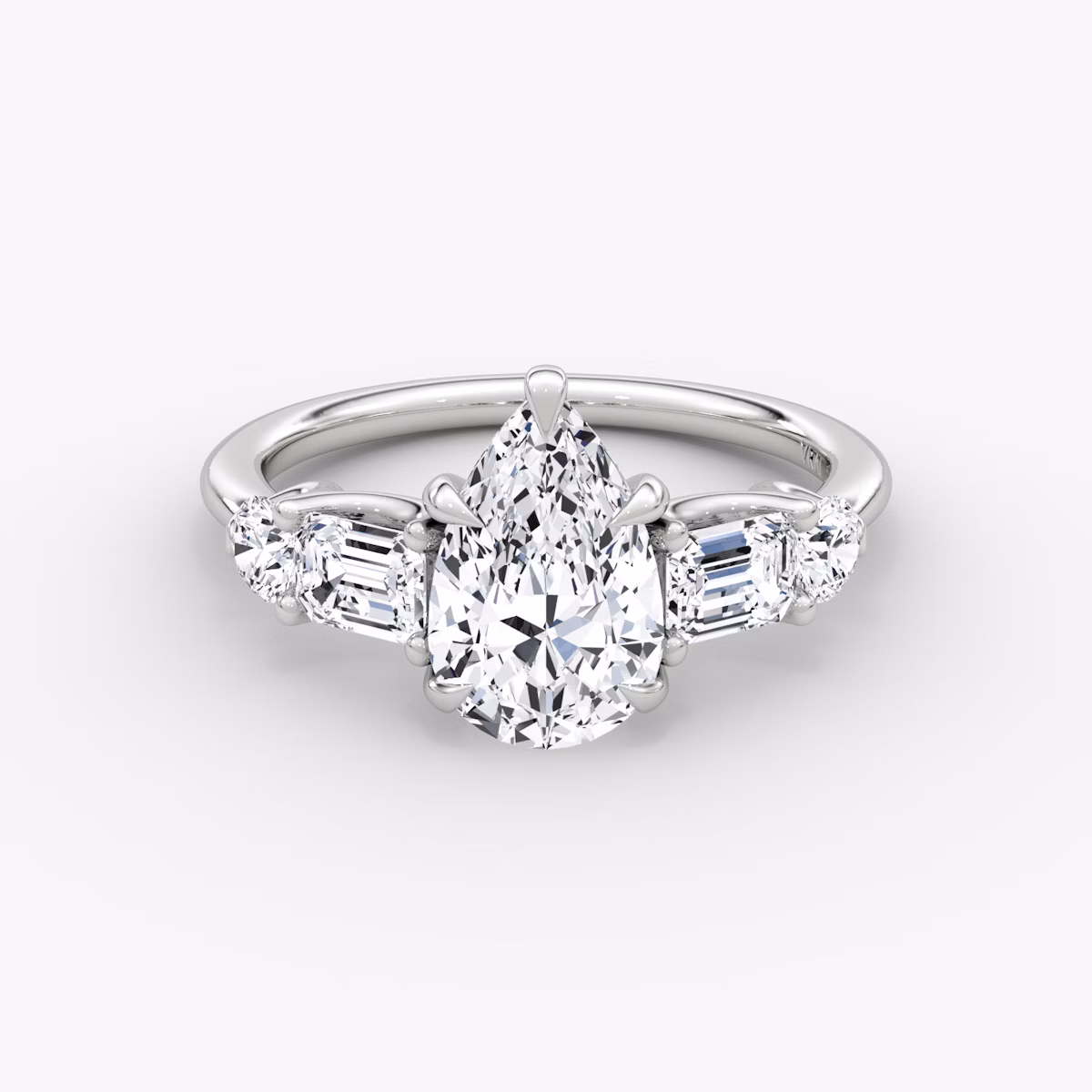 The Mixed Shape | Pear | 18k | White Gold | bandAccent: Plain | sideStoneOrientation: horizontal | sideStoneShape: Emerald and Round Brilliant | diamondOrientation: vertical | caratWeight: other