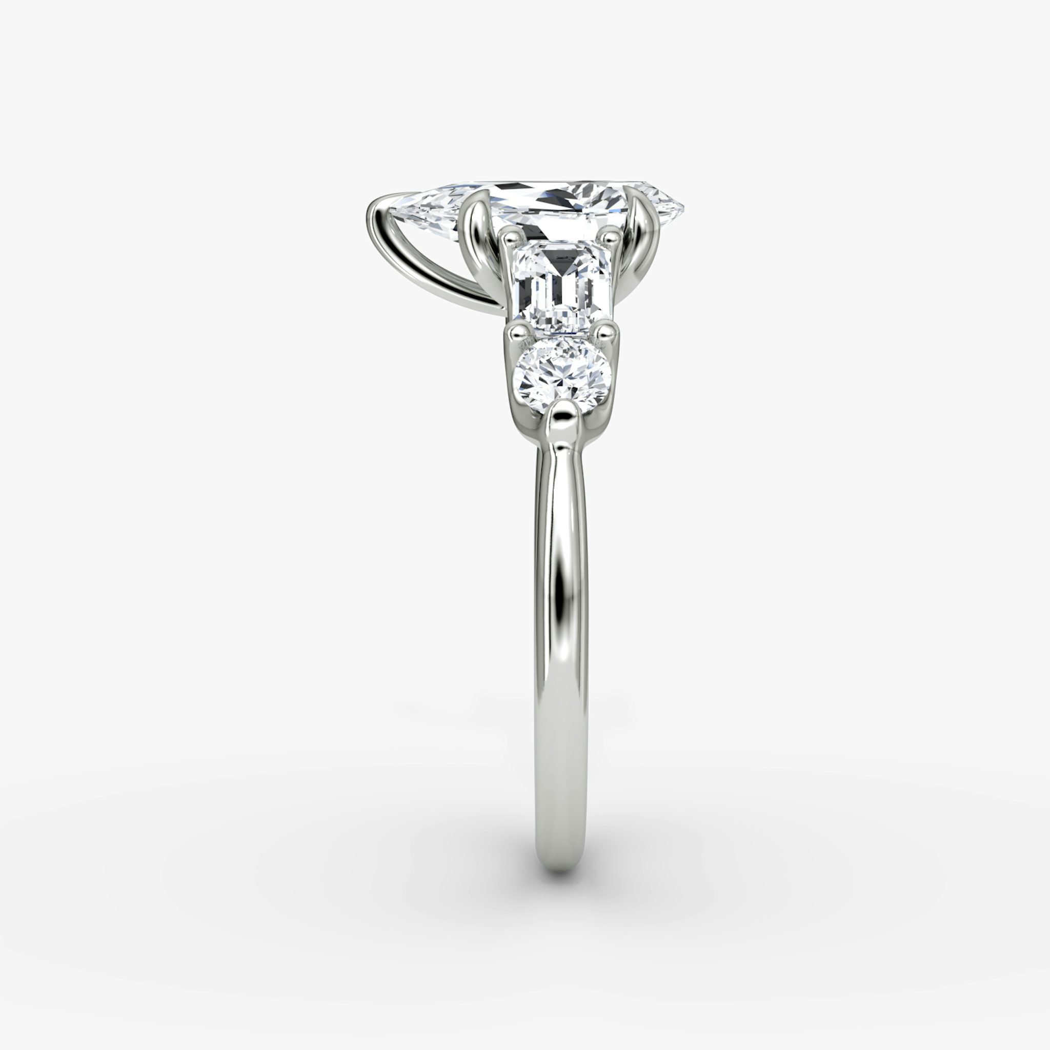 The Mixed Shape | Pear | 18k | White Gold | bandAccent: Plain | sideStoneOrientation: horizontal | sideStoneShape: Emerald and Round Brilliant | diamondOrientation: vertical | caratWeight: other
