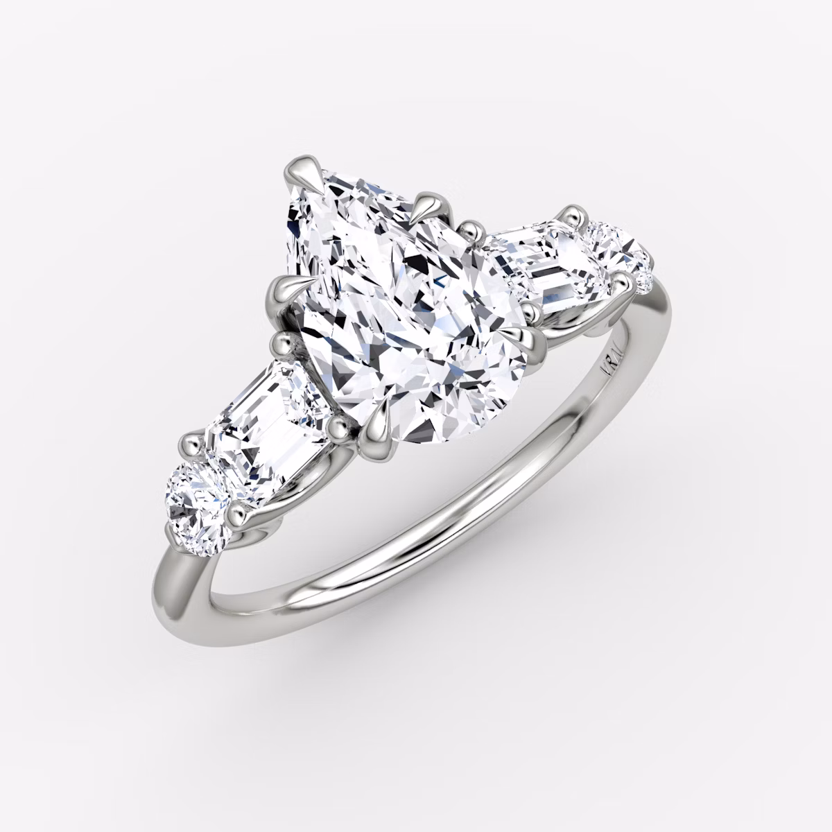 The Mixed Shape | Pear | 18k | White Gold | bandAccent: Plain | sideStoneOrientation: horizontal | sideStoneShape: Emerald and Round Brilliant | diamondOrientation: vertical | caratWeight: other