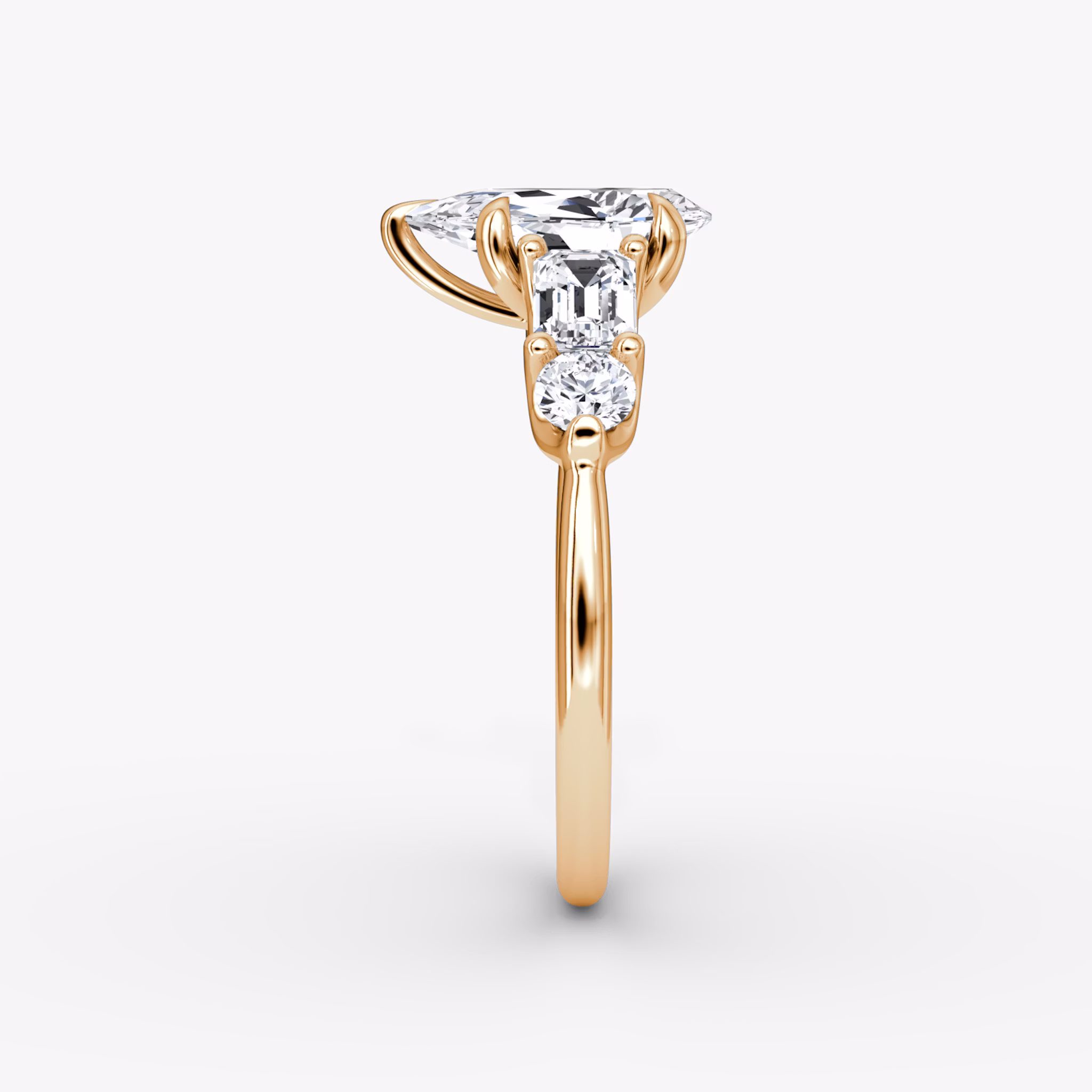 The Mixed Shape | Pear | 14k | Rose Gold | bandAccent: Plain | sideStoneOrientation: horizontal | sideStoneShape: Emerald and Round Brilliant | diamondOrientation: vertical | caratWeight: other