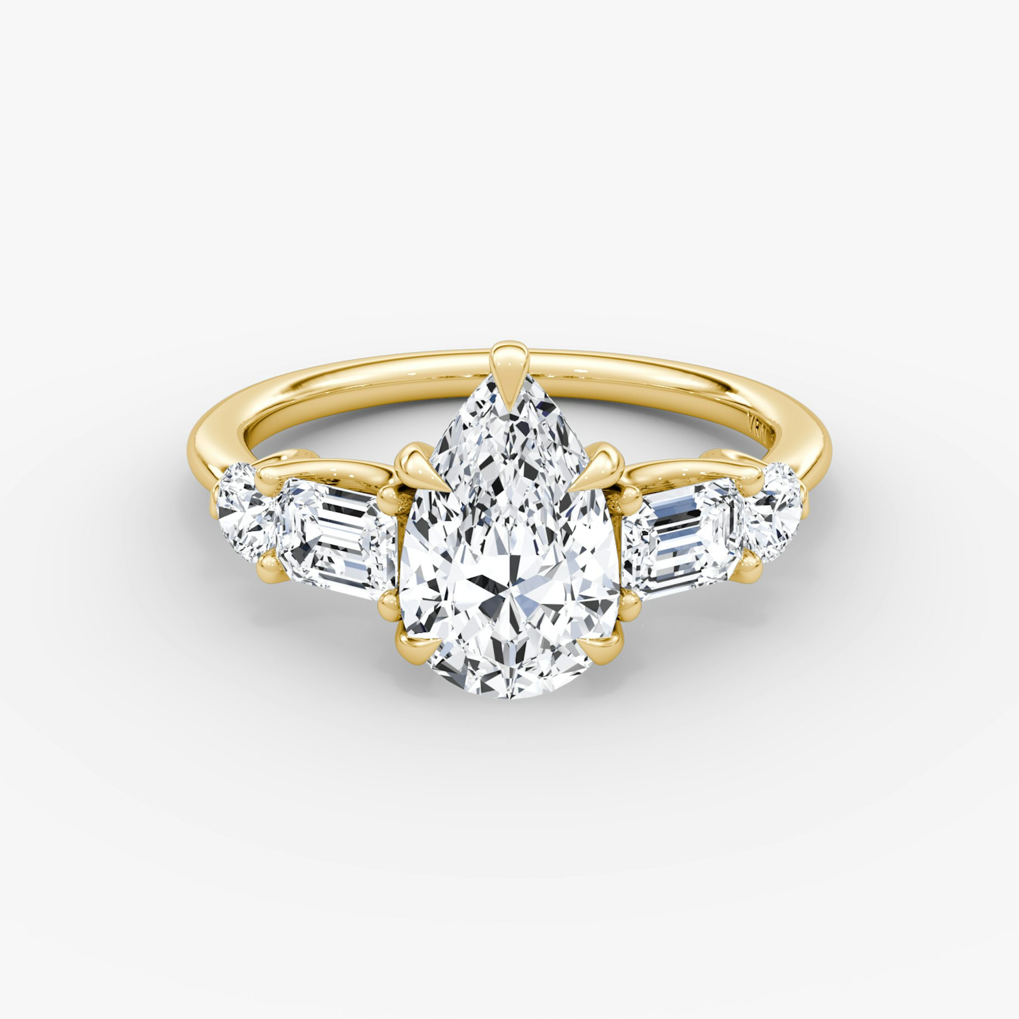The Mixed Shape | Pear | 18k | Yellow Gold | bandAccent: Plain | sideStoneOrientation: horizontal | sideStoneShape: Emerald and Round Brilliant | diamondOrientation: vertical | caratWeight: other