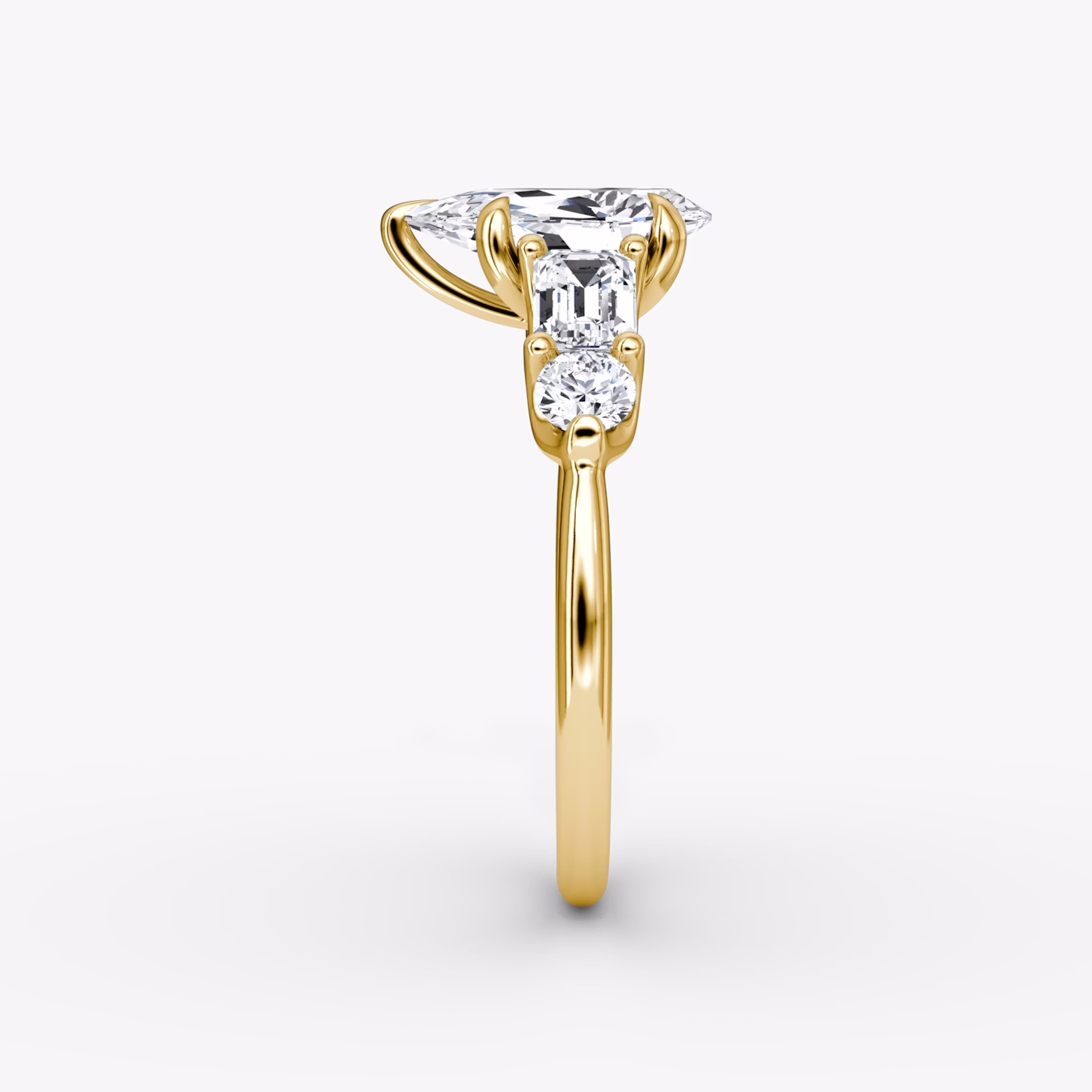 The Mixed Shape | Pear | 18k | Yellow Gold | bandAccent: Plain | sideStoneOrientation: horizontal | sideStoneShape: Emerald and Round Brilliant | diamondOrientation: vertical | caratWeight: other