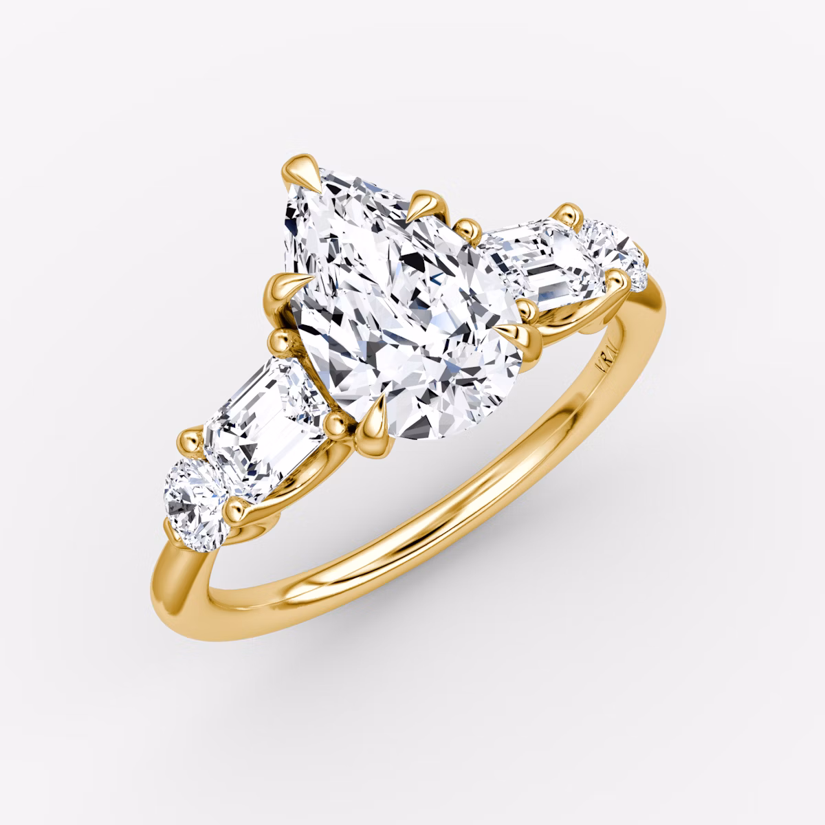 The Mixed Shape | Pear | 18k | Yellow Gold | bandAccent: Plain | sideStoneOrientation: horizontal | sideStoneShape: Emerald and Round Brilliant | diamondOrientation: vertical | caratWeight: other