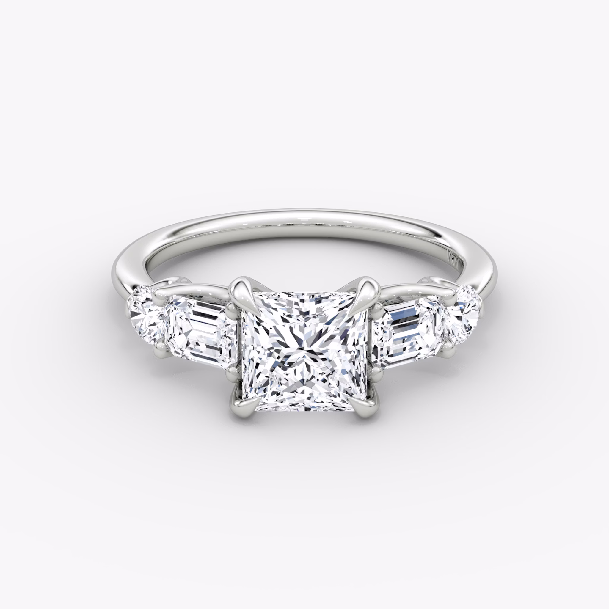 The Mixed Shape | Princess | 18k | White Gold | bandAccent: Plain | sideStoneOrientation: horizontal | sideStoneShape: Emerald and Round Brilliant | diamondOrientation: vertical | caratWeight: other
