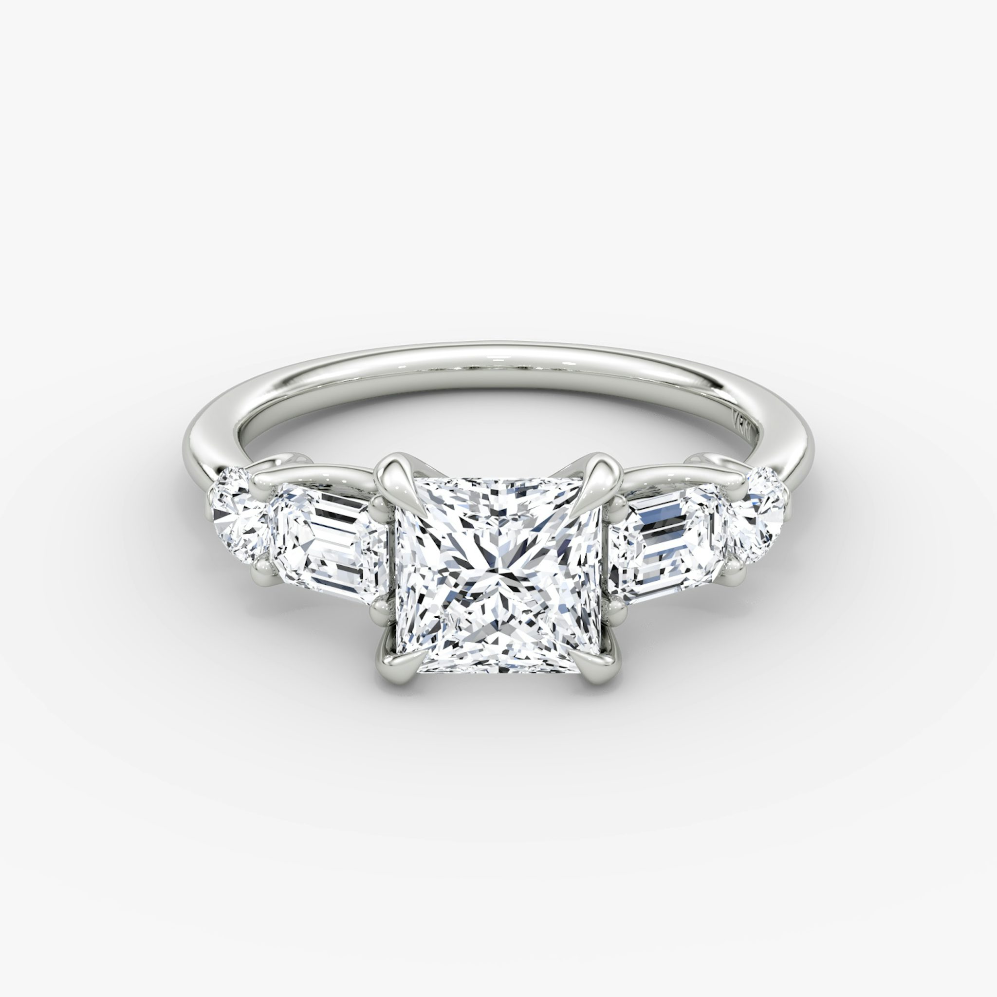 The Mixed Shape | Princess | 18k | White Gold | bandAccent: Plain | sideStoneOrientation: horizontal | sideStoneShape: Emerald and Round Brilliant | diamondOrientation: vertical | caratWeight: other