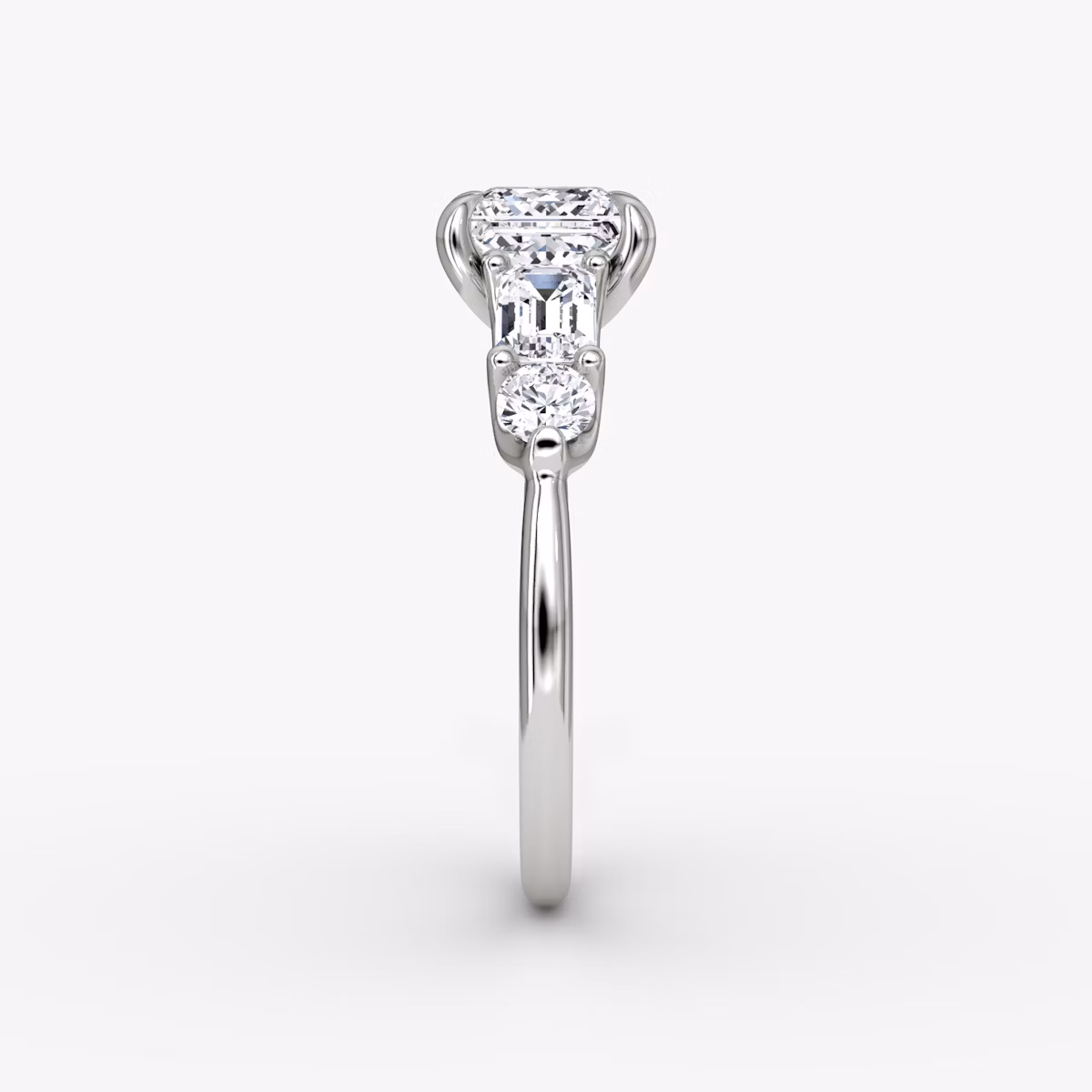 The Mixed Shape | Princess | Platinum | bandAccent: Plain | sideStoneOrientation: horizontal | sideStoneShape: Emerald and Round Brilliant | diamondOrientation: vertical | caratWeight: other