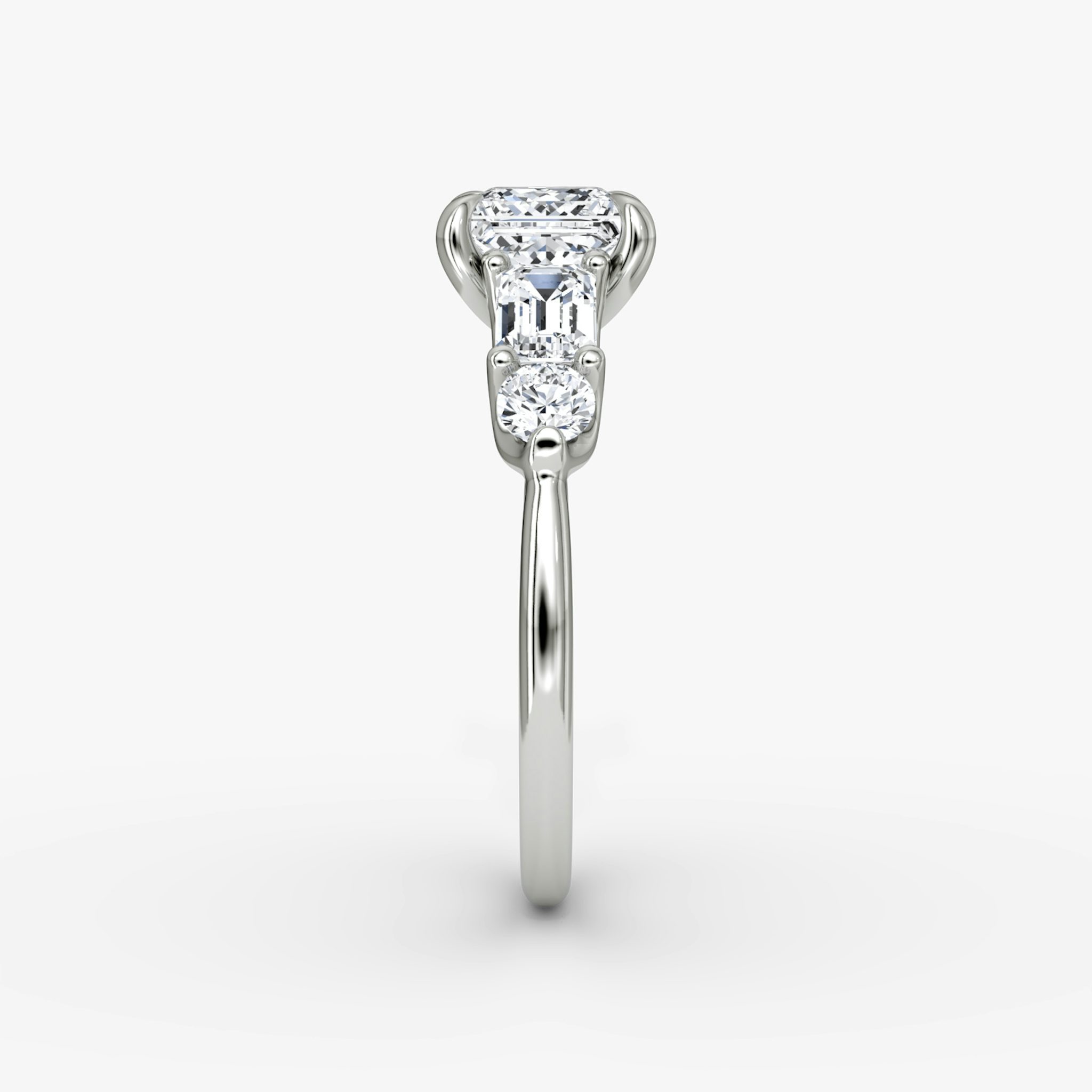The Mixed Shape | Princess | 18k | White Gold | bandAccent: Plain | sideStoneOrientation: horizontal | sideStoneShape: Emerald and Round Brilliant | diamondOrientation: vertical | caratWeight: other