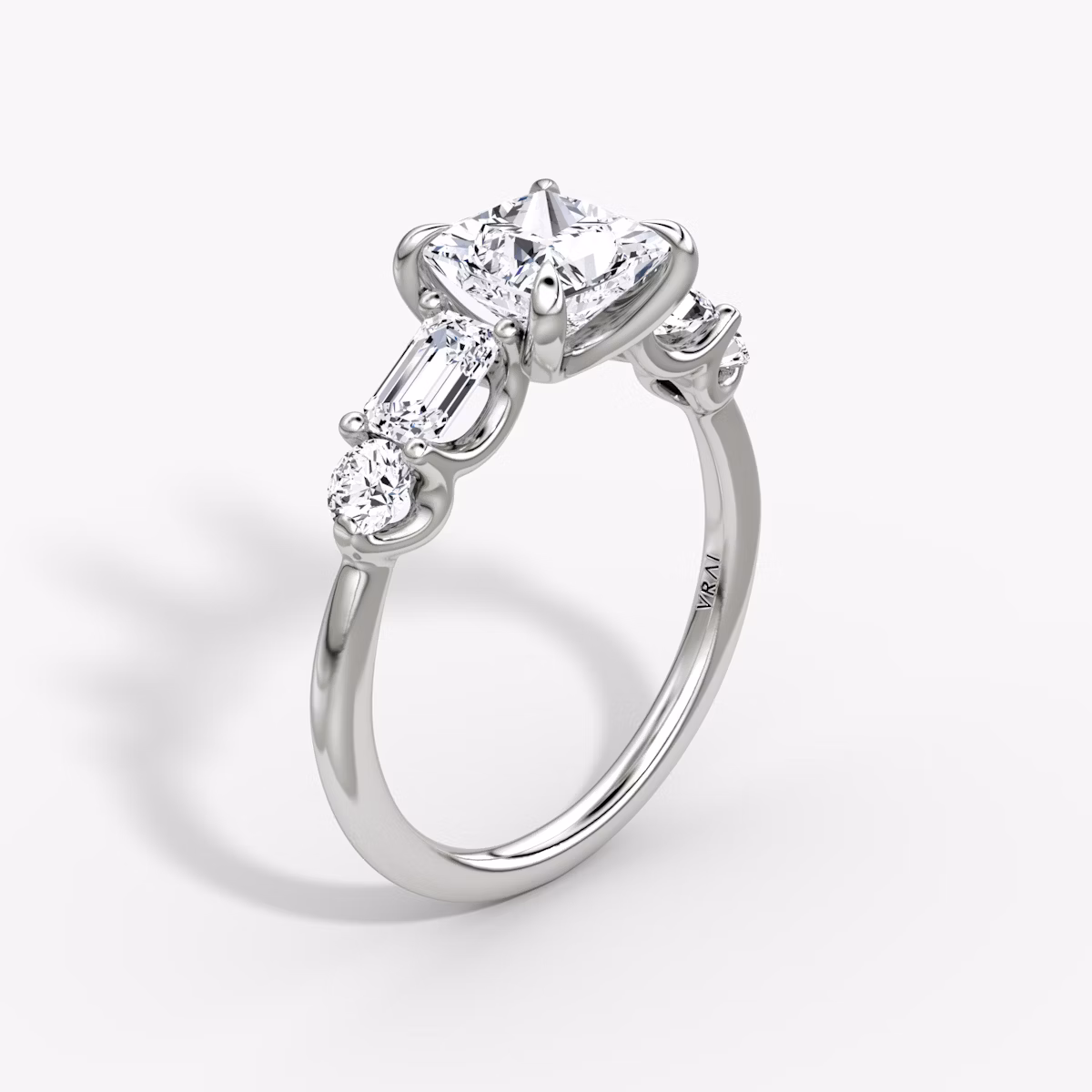 The Mixed Shape | Princess | Platinum | bandAccent: Plain | sideStoneOrientation: horizontal | sideStoneShape: Emerald and Round Brilliant | diamondOrientation: vertical | caratWeight: other